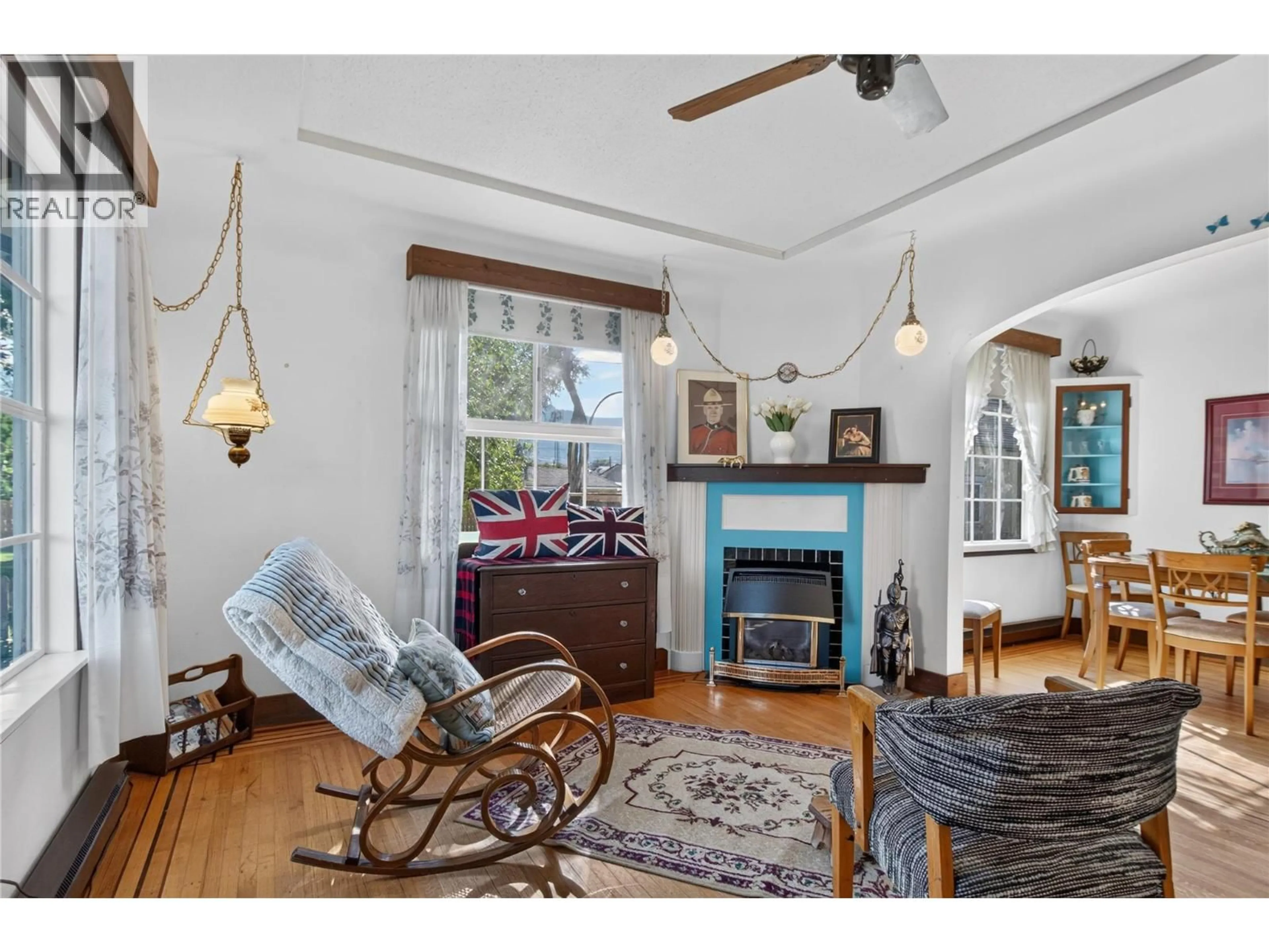 Living room with furniture, wood/laminate floor for 244 CONKLIN AVENUE, Penticton British Columbia V2A2T2