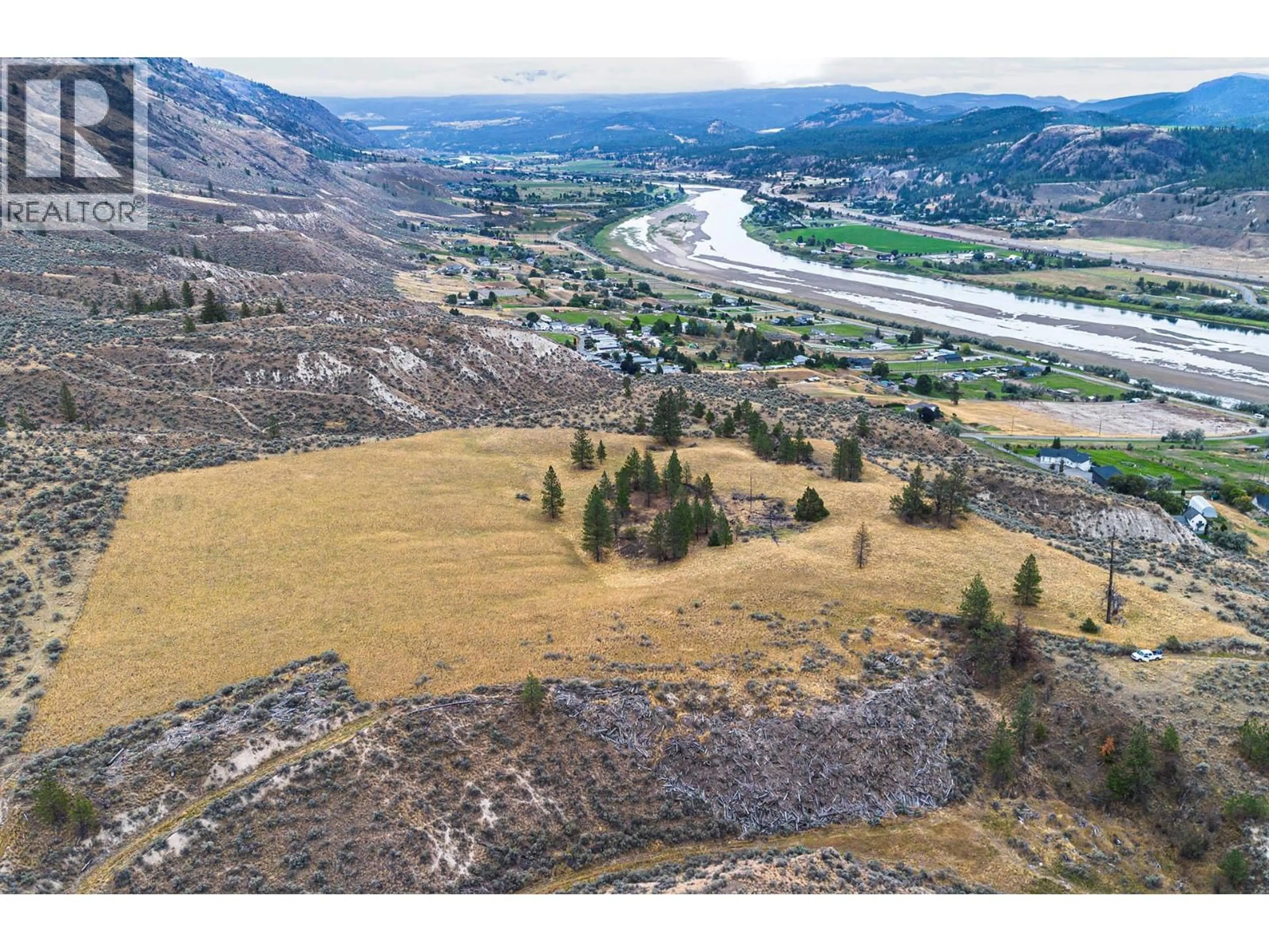 A pic from outside/outdoor area/front of a property/back of a property/a pic from drone, mountain view for 3059 SHUSWAP E ROAD, Kamloops British Columbia V2H1T1