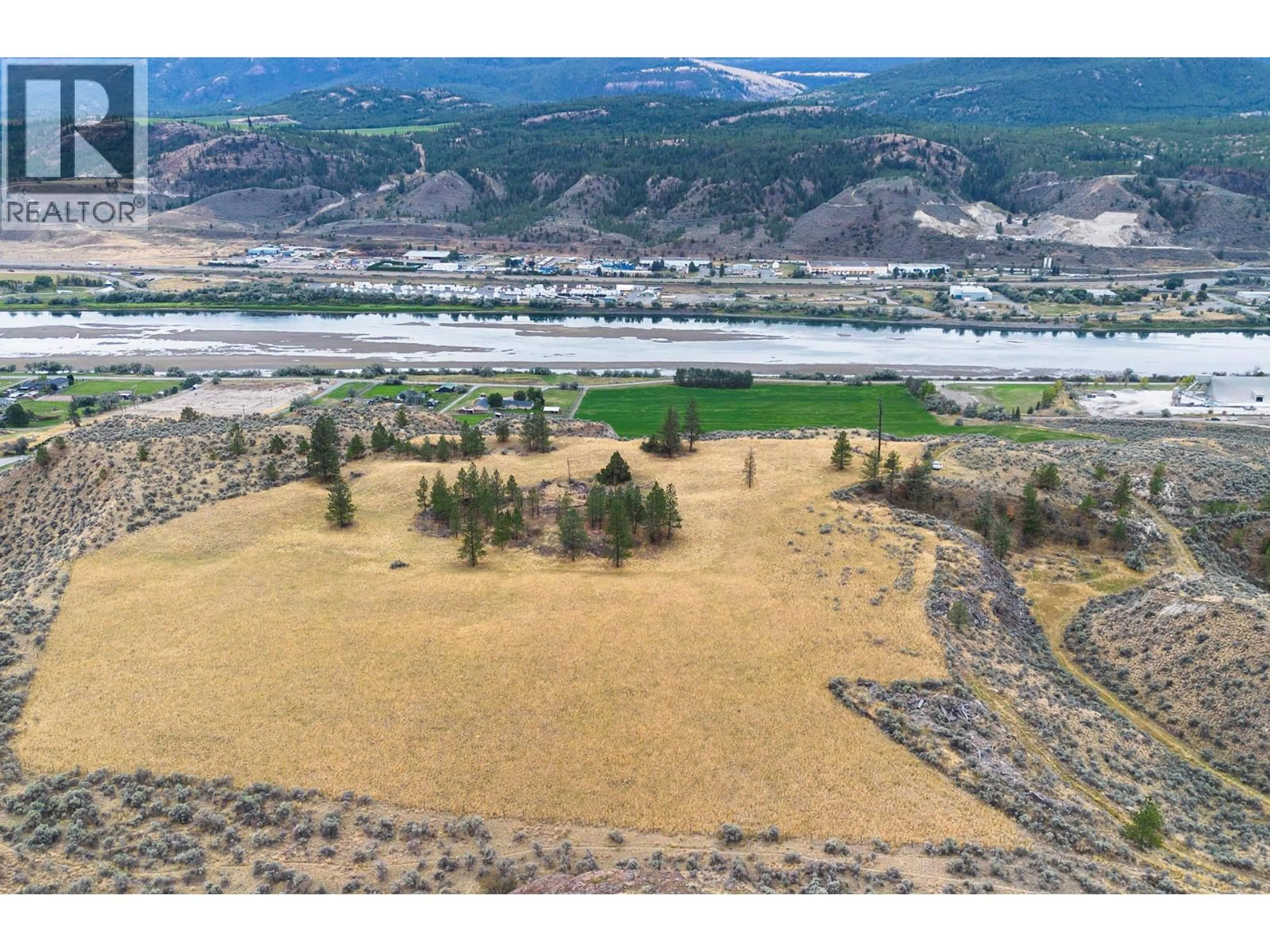 A pic from outside/outdoor area/front of a property/back of a property/a pic from drone, water/lake/river/ocean view for 3059 SHUSWAP E ROAD, Kamloops British Columbia V2H1T1