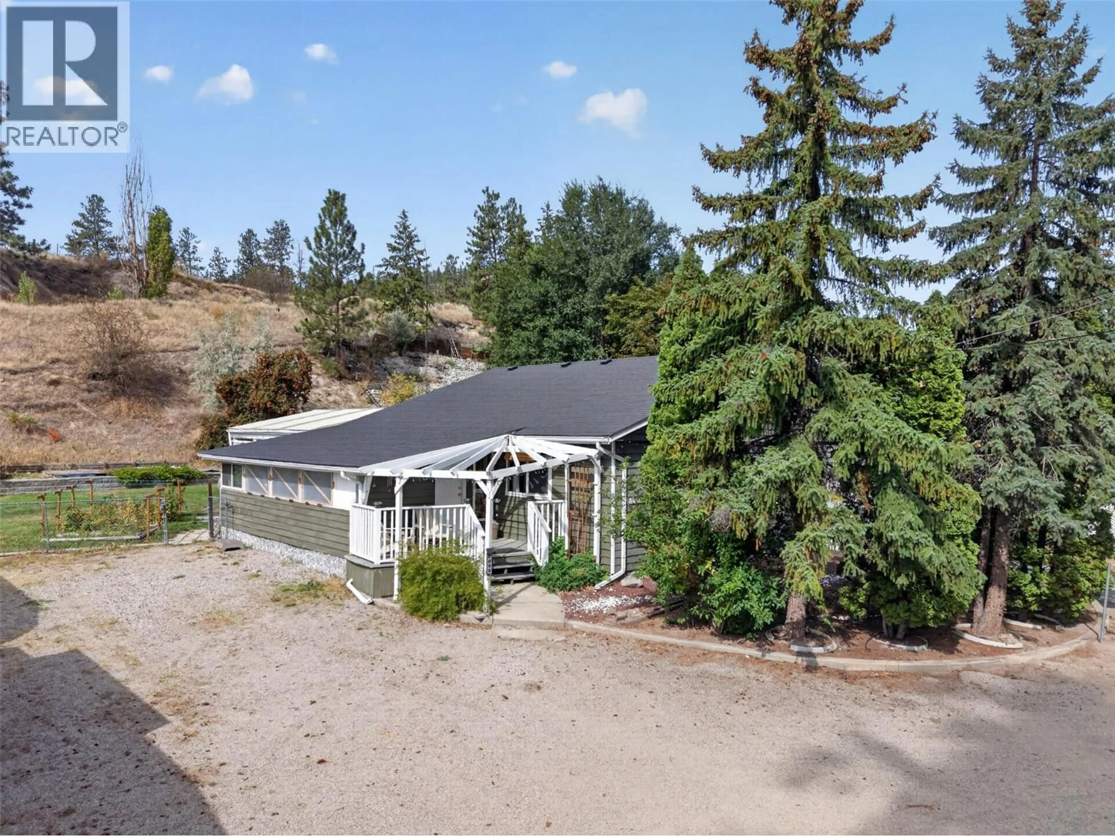 A pic from outside/outdoor area/front of a property/back of a property/a pic from drone, mountain view for 8008 VICTORIA ROAD, Summerland British Columbia V0H1Z2