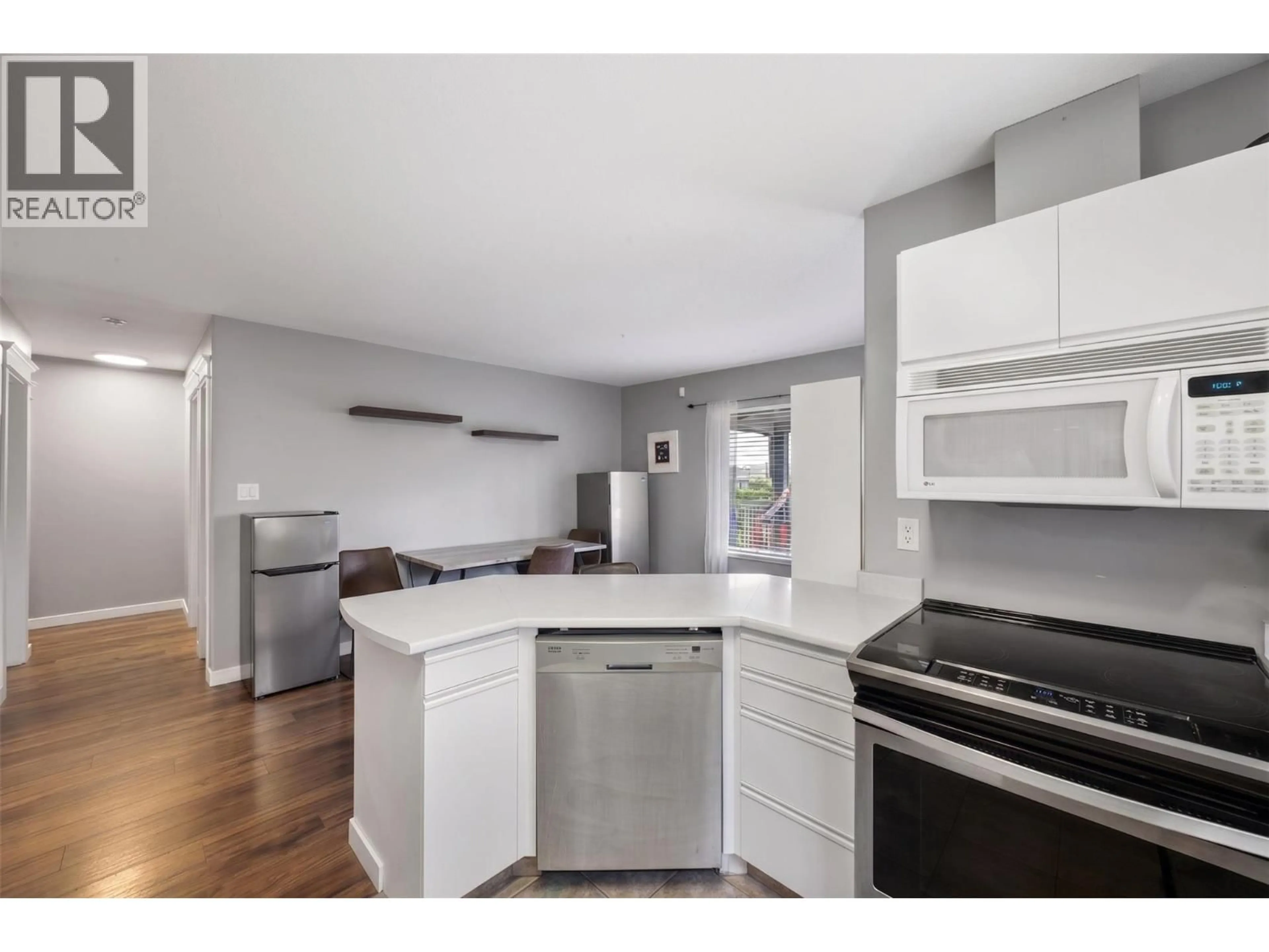 Open concept kitchen, wood/laminate floor for 2277 TURNBERRY PLACE, Kamloops British Columbia V1S1S9