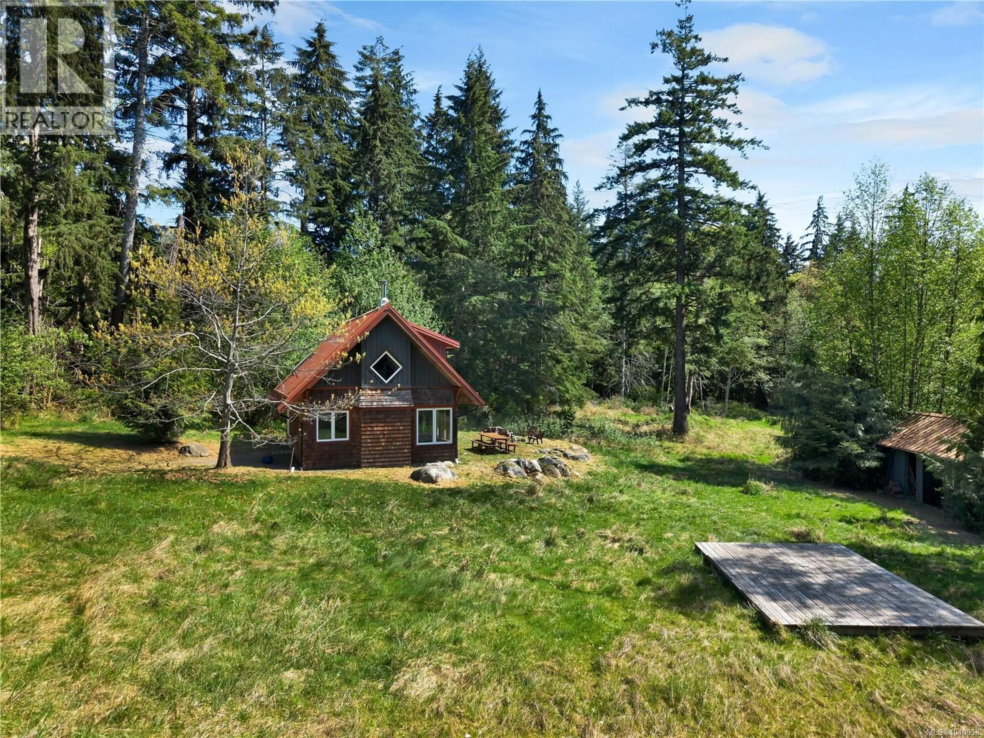 A pic from outside/outdoor area/front of a property/back of a property/a pic from drone, forest/trees view for 653 HERIOT BAY ROAD, Quadra Island British Columbia V0P1N0