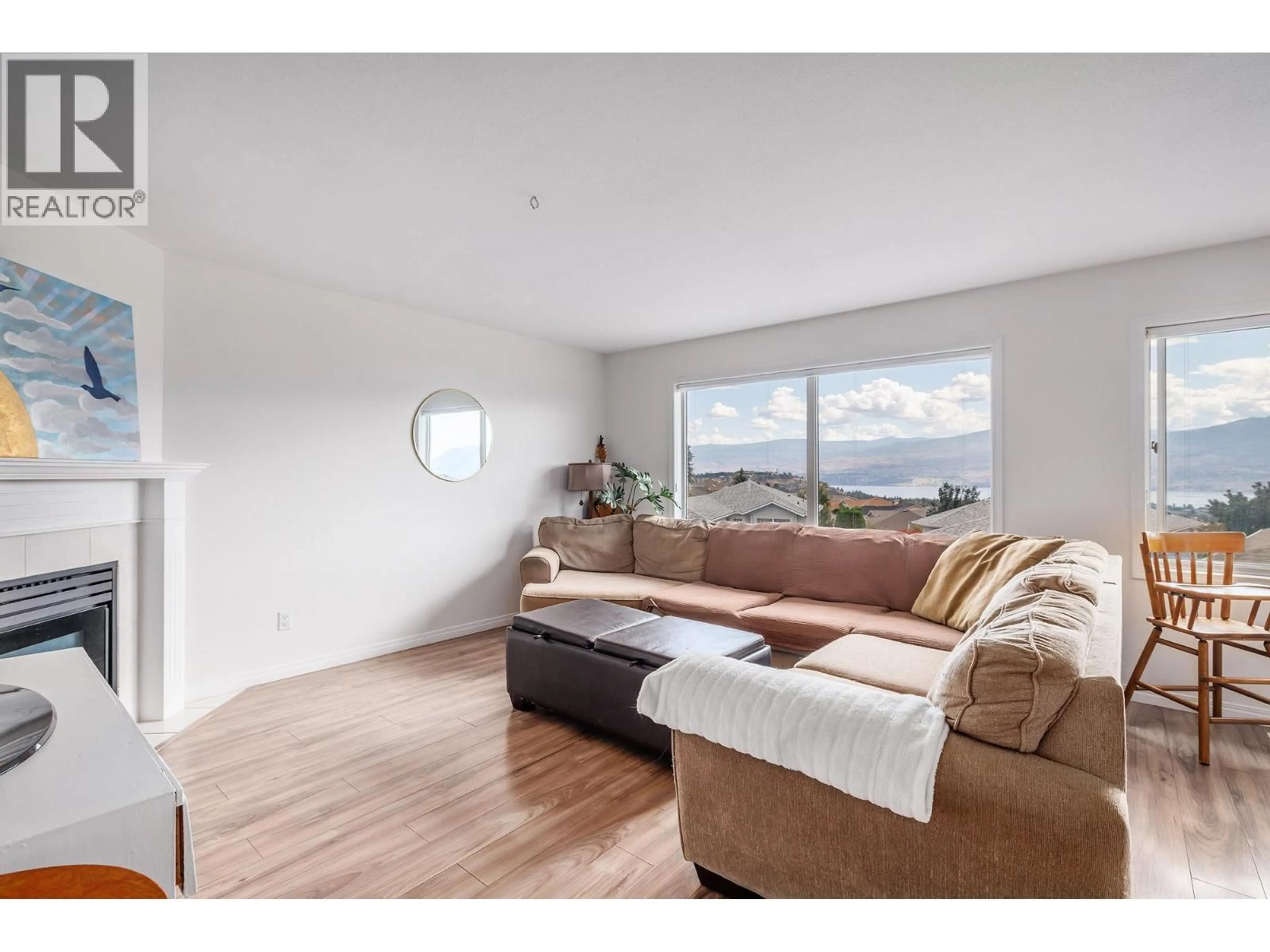 Living room with furniture, wood/laminate floor for 328 - 2440 OLD OKANAGAN HIGHWAY, West Kelowna British Columbia V4T1X6