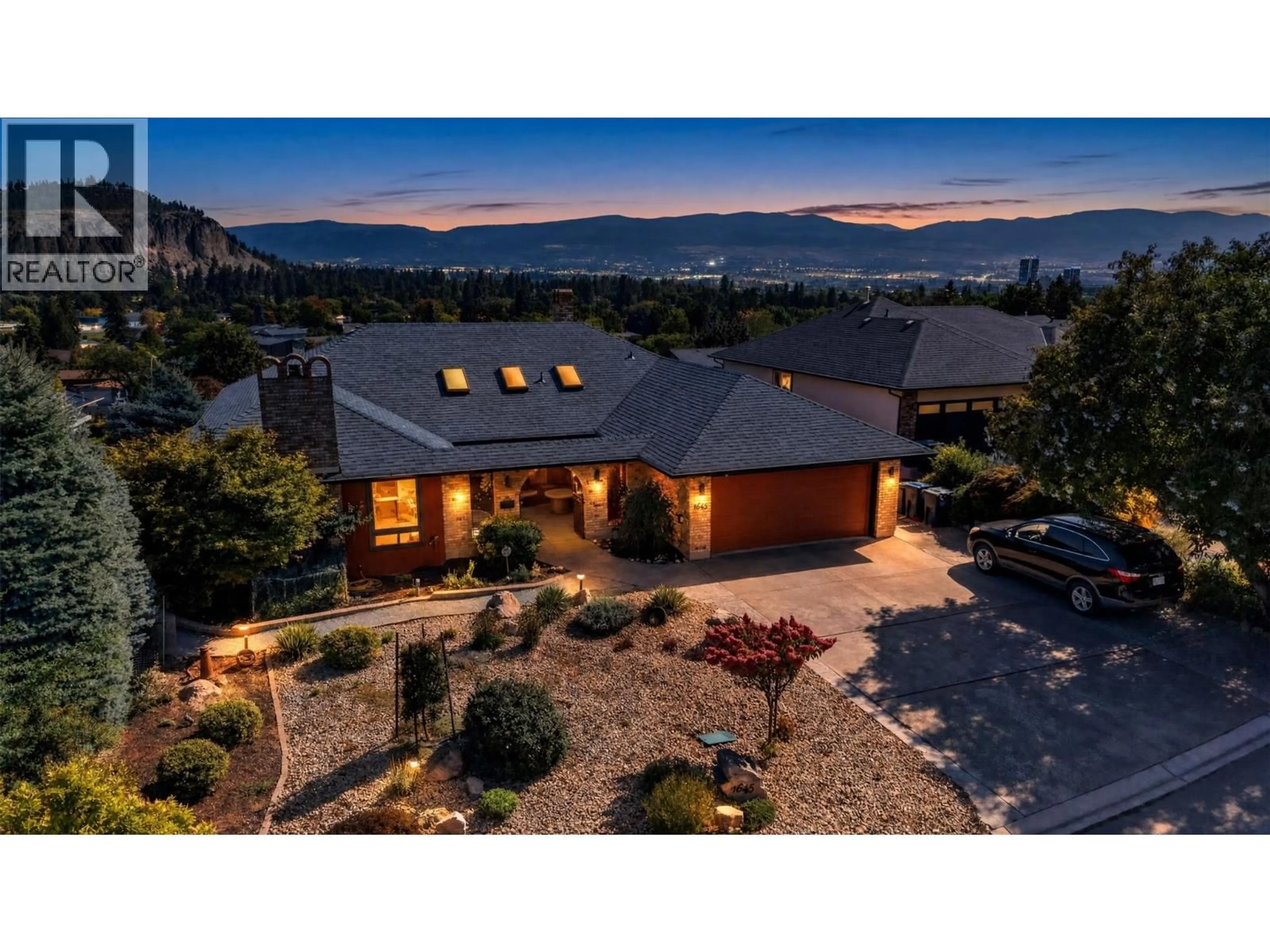 A pic from outside/outdoor area/front of a property/back of a property/a pic from drone, mountain view for 1645 SMITHSON PLACE, Kelowna British Columbia V1Y8N5