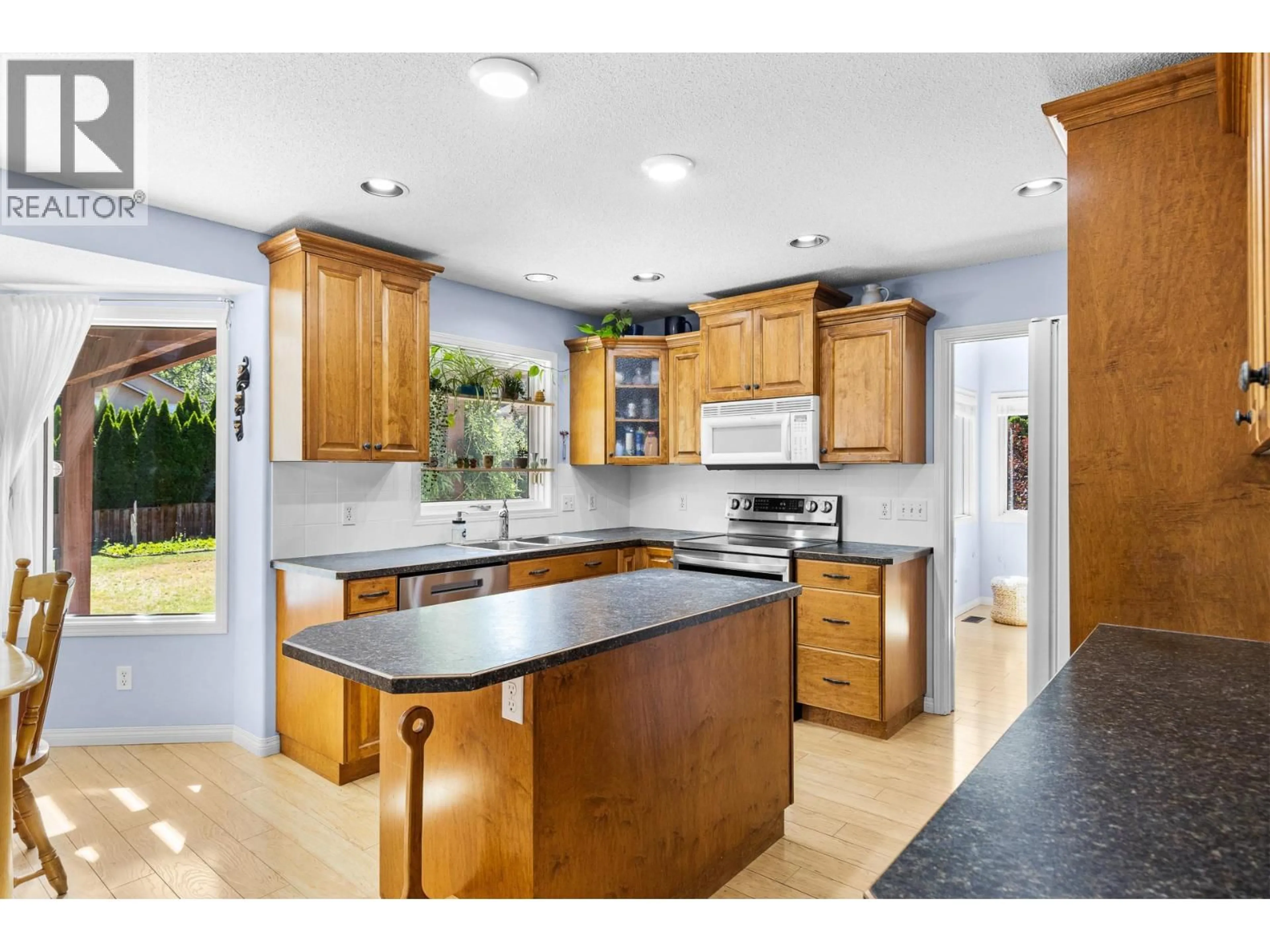 Open concept kitchen, ceramic/tile floor for 4015 MAHONIA DRIVE, Kelowna British Columbia V1W3Y2