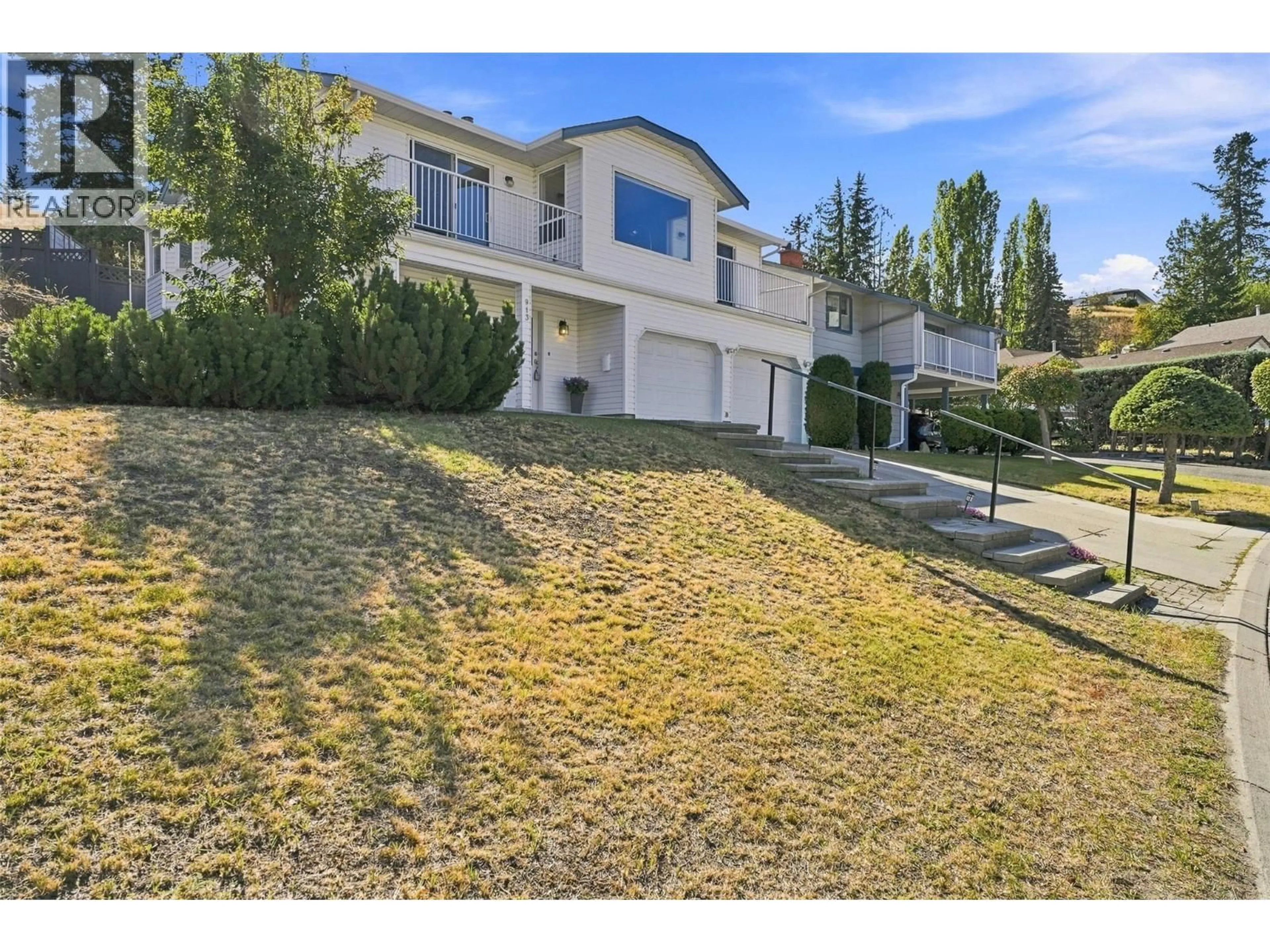 A pic from outside/outdoor area/front of a property/back of a property/a pic from drone, street for 913 GREYSTONE CRESCENT, Kamloops British Columbia V1S1K7