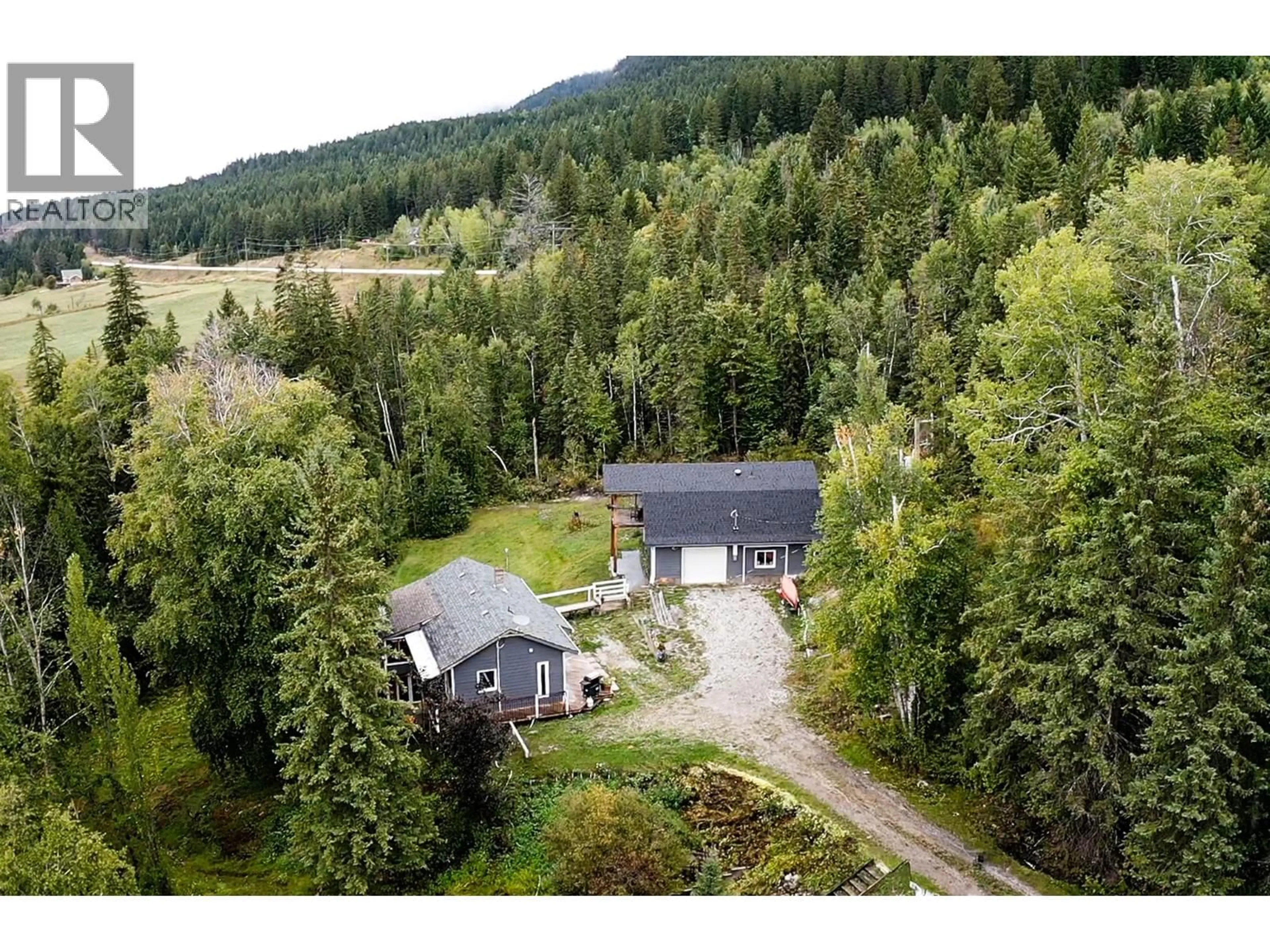 A pic from outside/outdoor area/front of a property/back of a property/a pic from drone, forest/trees view for 2529 95 HIGHWAY, Brisco British Columbia V0A1B0