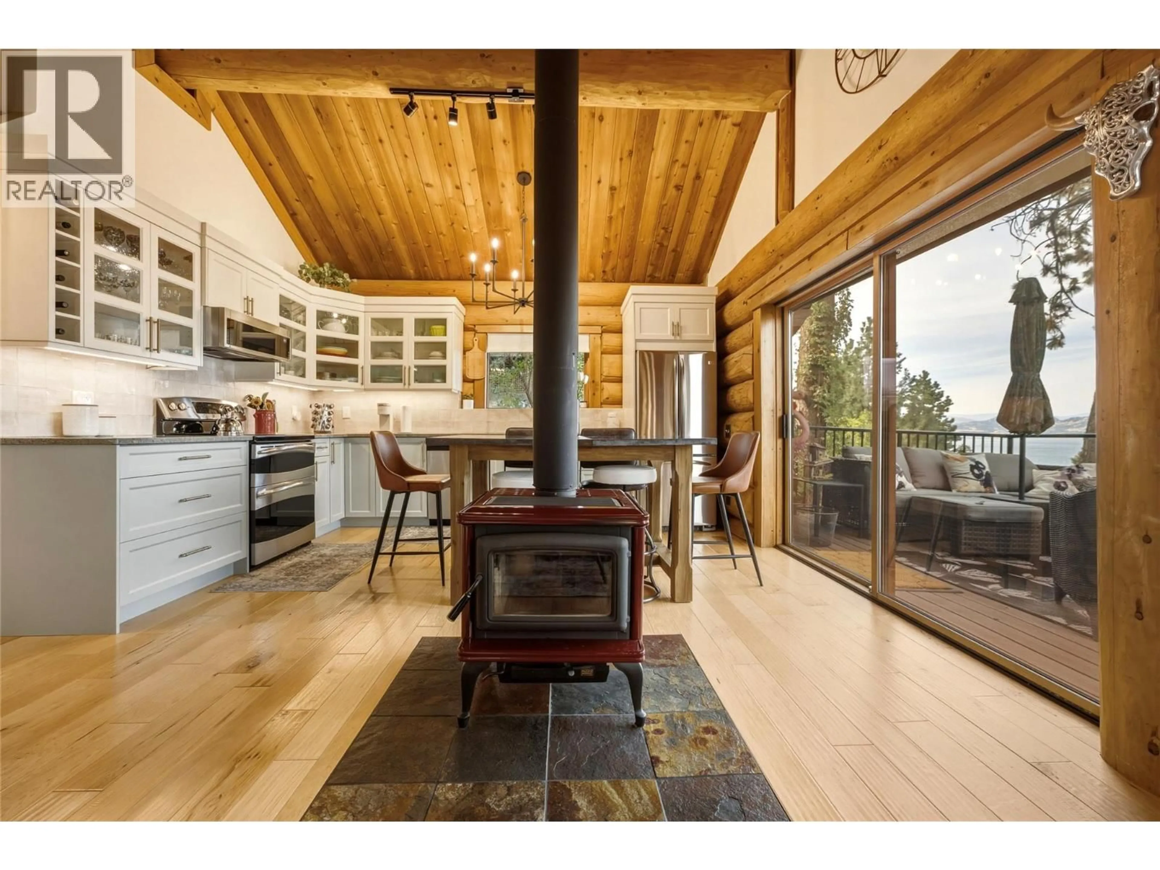 Open concept kitchen, wood/laminate floor for 1934 PALY ROAD, Kelowna British Columbia V1V2B9