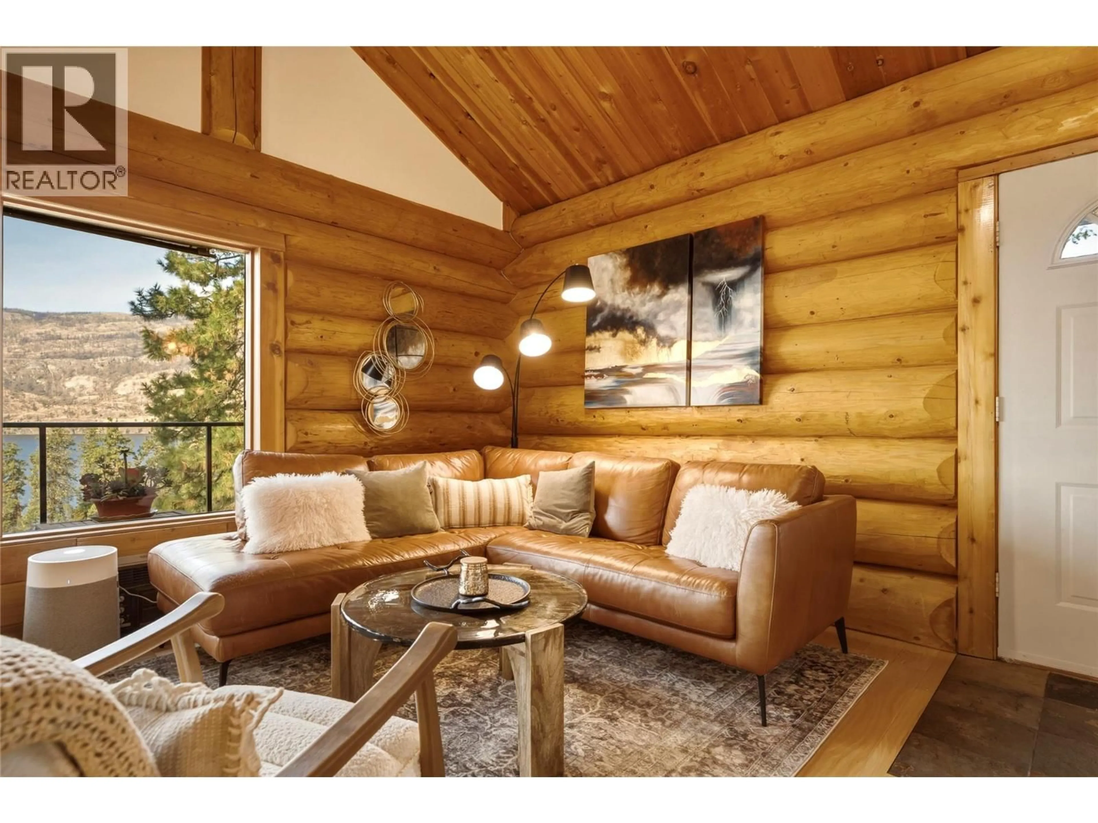 Living room with furniture, wood/laminate floor for 1934 PALY ROAD, Kelowna British Columbia V1V2B9