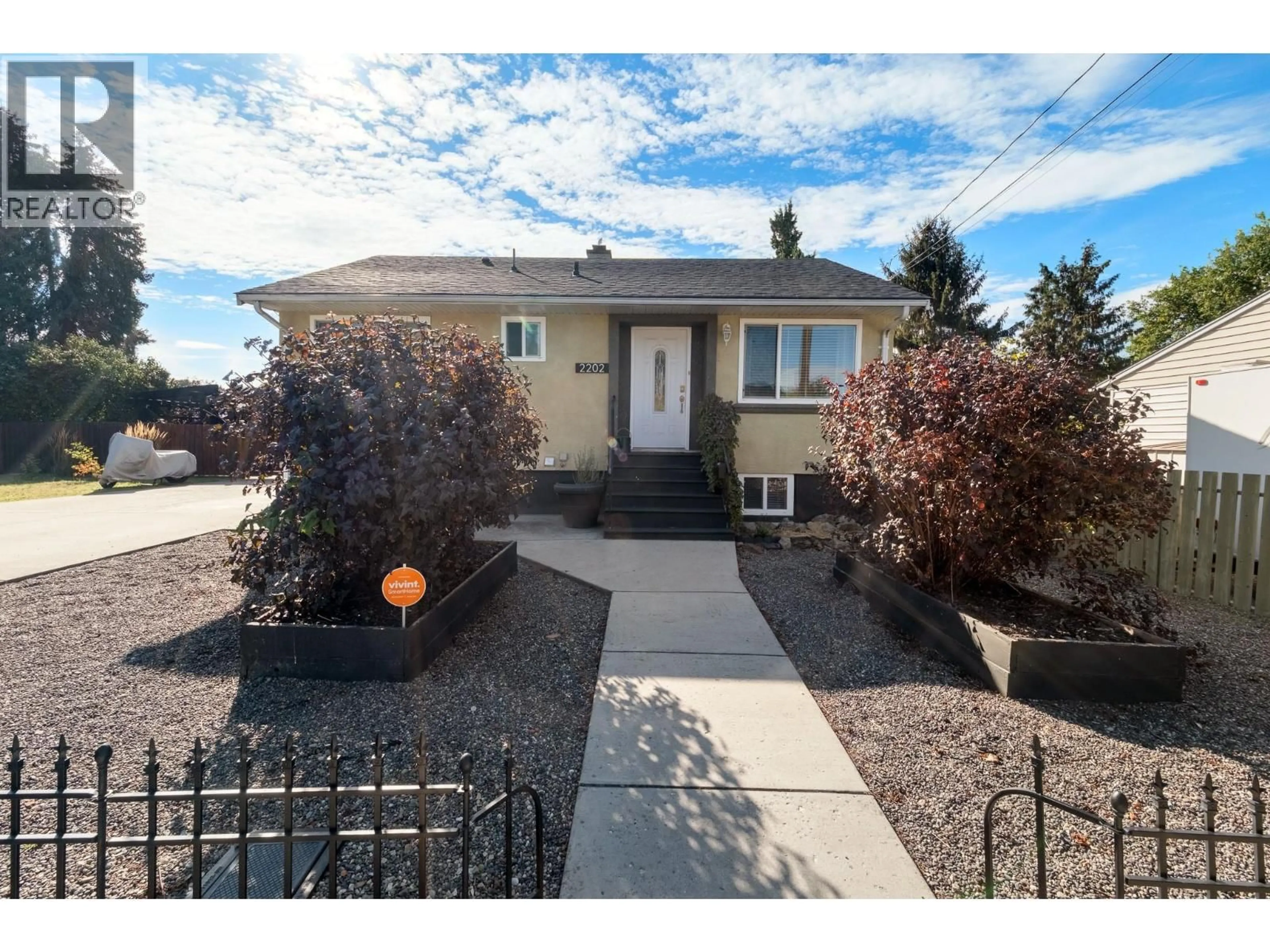Home with vinyl exterior material, street for 2202 42 AVENUE, Vernon British Columbia V1T3J3