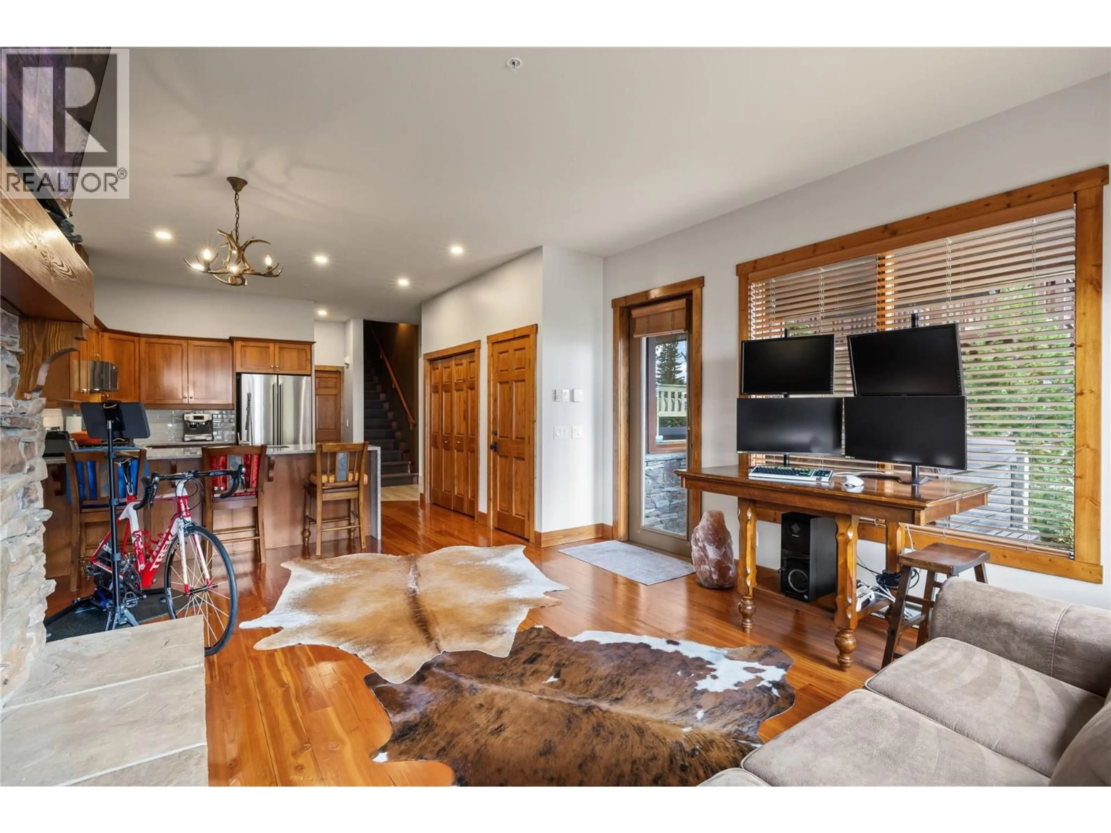 Living room with furniture, wood/laminate floor for 1 - 5925 SNOW PINES WAY, Big White British Columbia V1P1T4