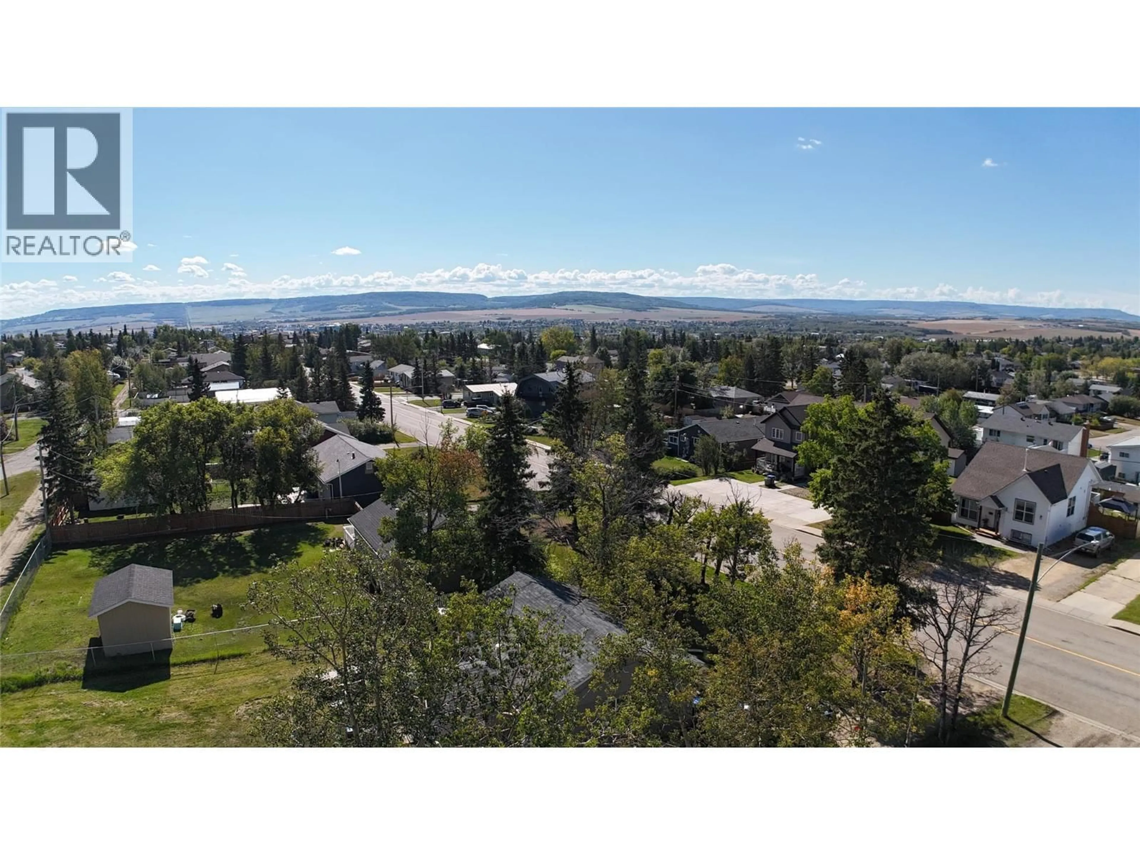 A pic from outside/outdoor area/front of a property/back of a property/a pic from drone, mountain view for 9108 8 STREET, Dawson Creek British Columbia V1G3N4