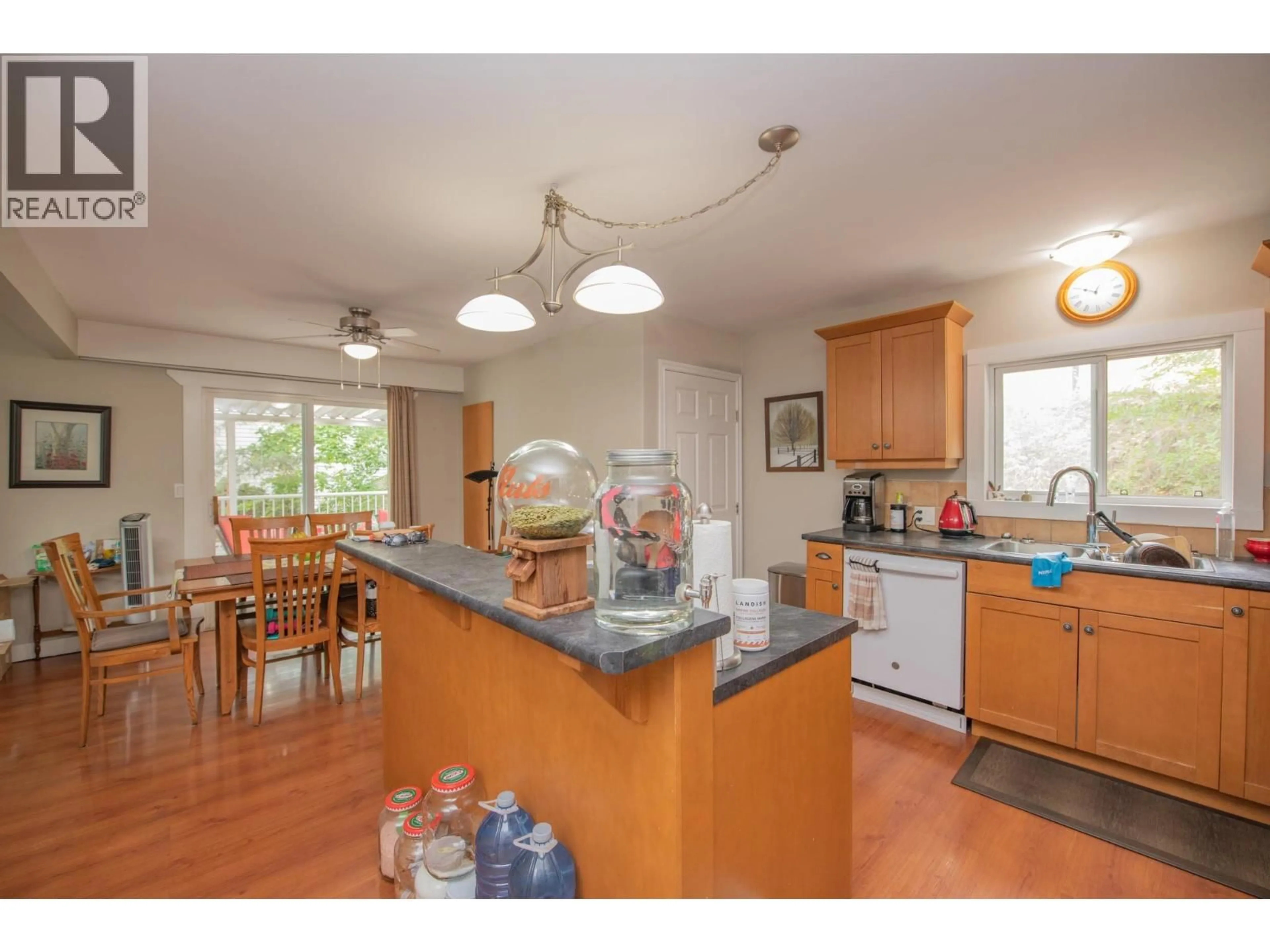 Open concept kitchen, wood/laminate floor for 12005 KALAMALKA ROAD, Coldstream British Columbia V1B1M3