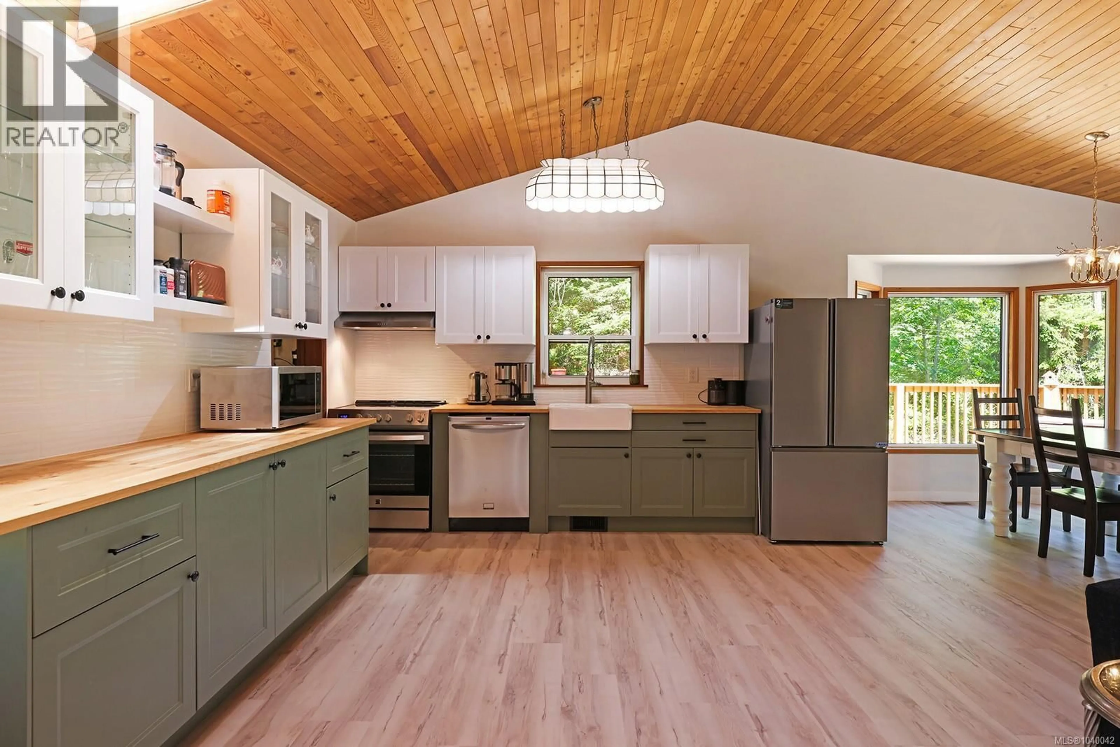 Open concept kitchen, wood/laminate floor for 6585 WALKER FRONTAGE ROAD, Fanny Bay British Columbia V0R1W0