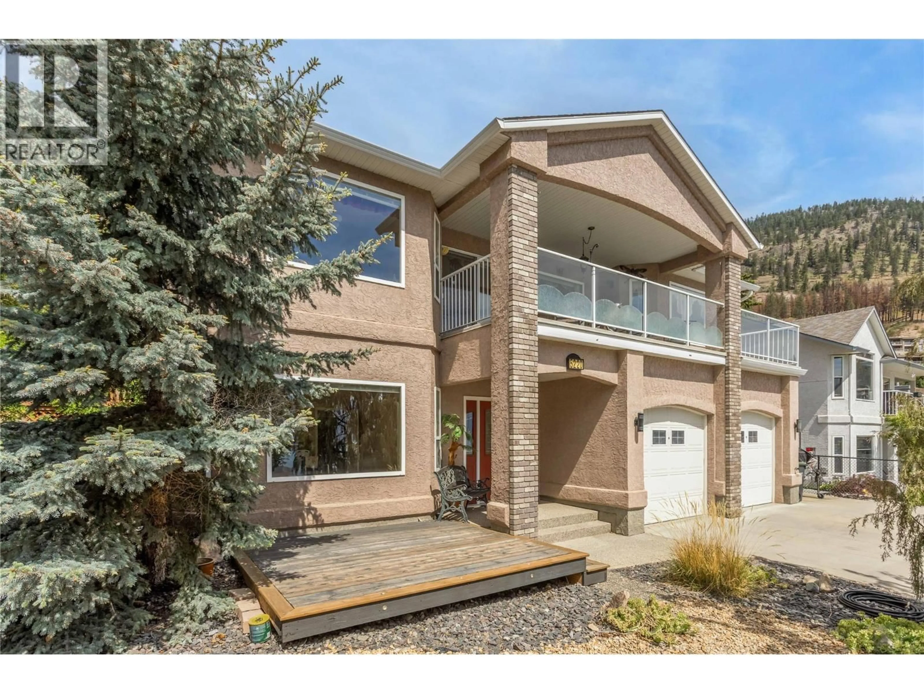 Home with vinyl exterior material, street for 5220 SUTHERLAND ROAD, Peachland British Columbia V0H1X0