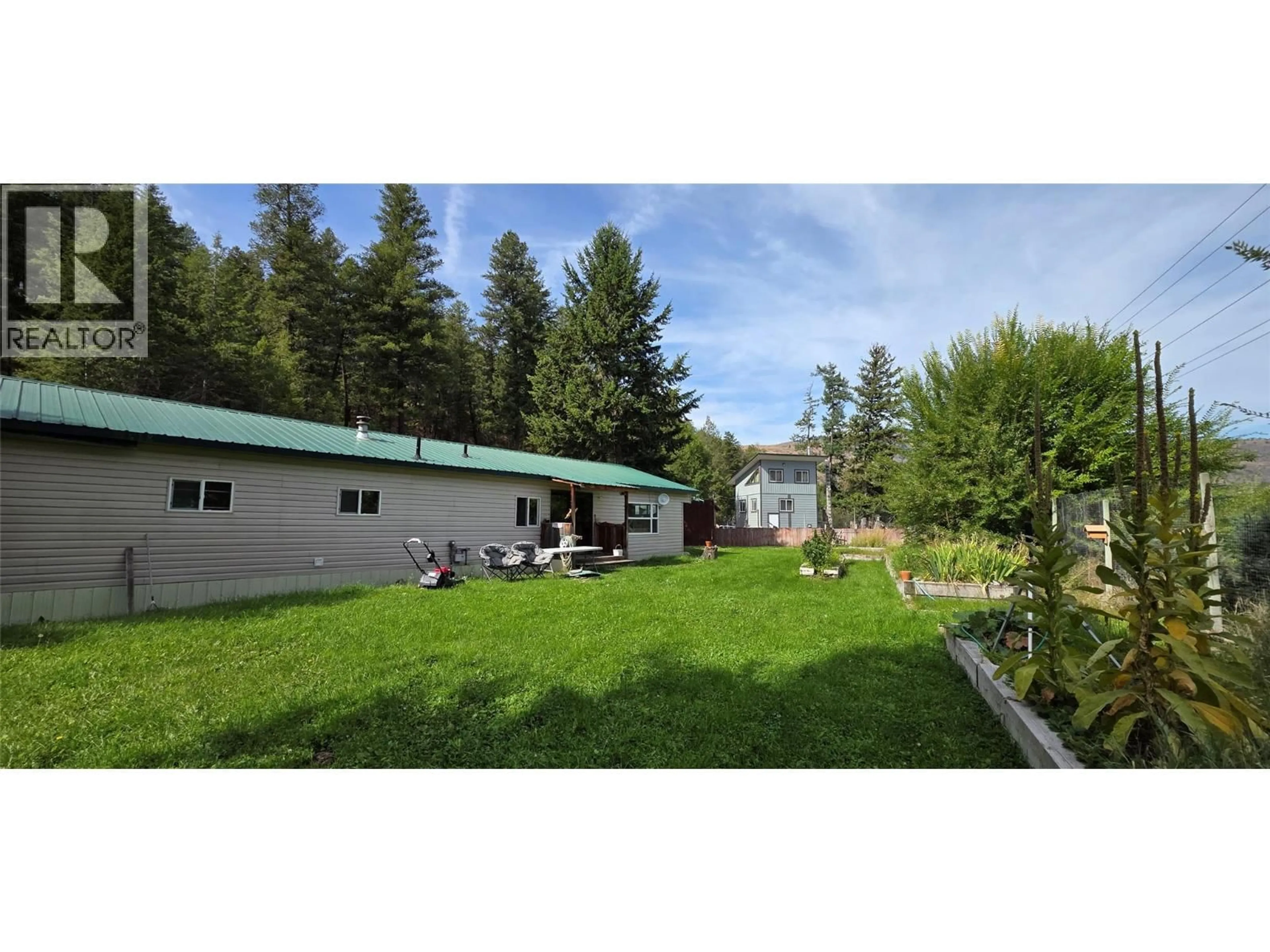 A pic from outside/outdoor area/front of a property/back of a property/a pic from drone, mountain view for 4098 HIGHWAY 3 OTHER, Rock Creek British Columbia V0H1Y0