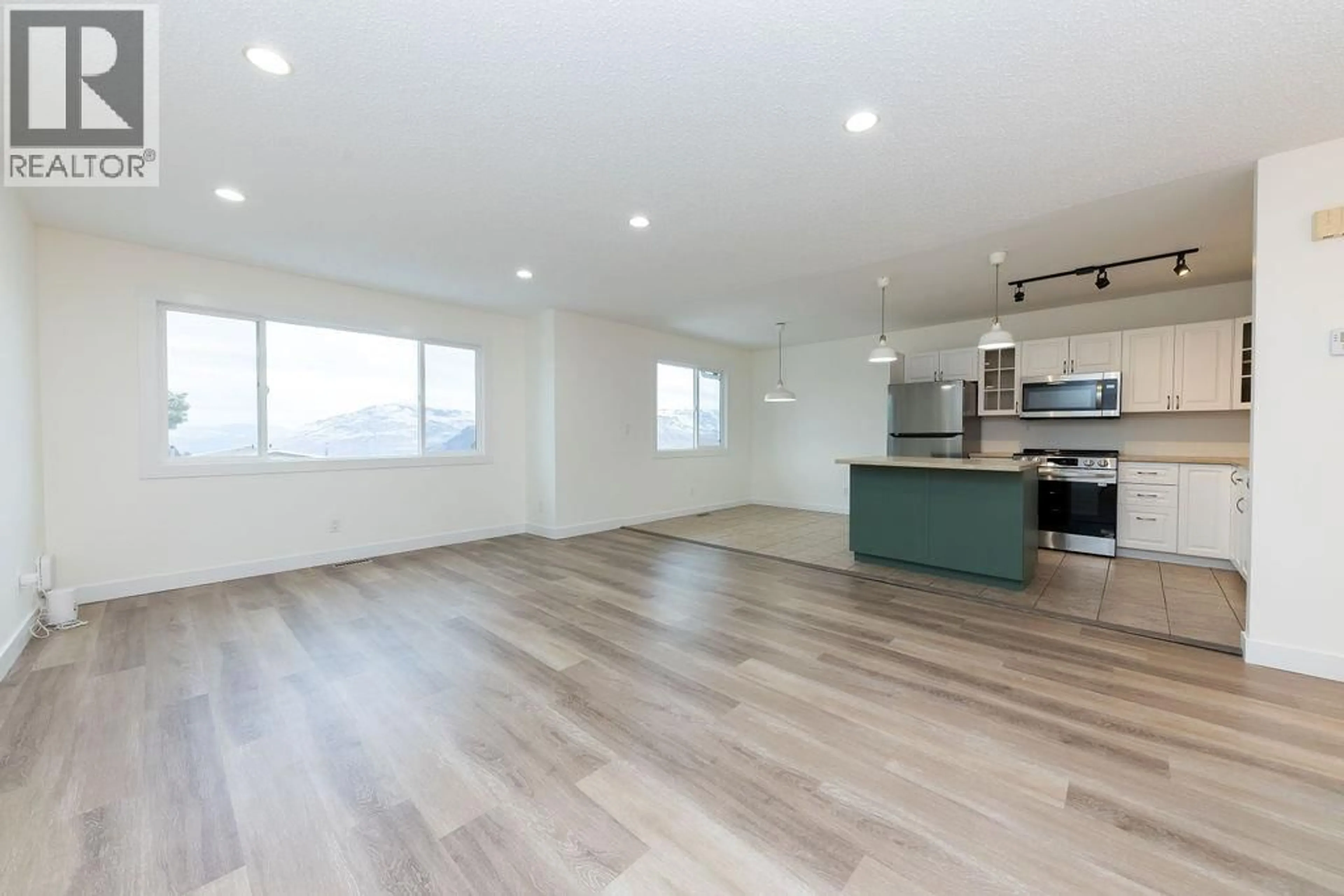 Open concept kitchen, wood/laminate floor for 393 WADDINGTON DRIVE, Kamloops British Columbia V2E1S3
