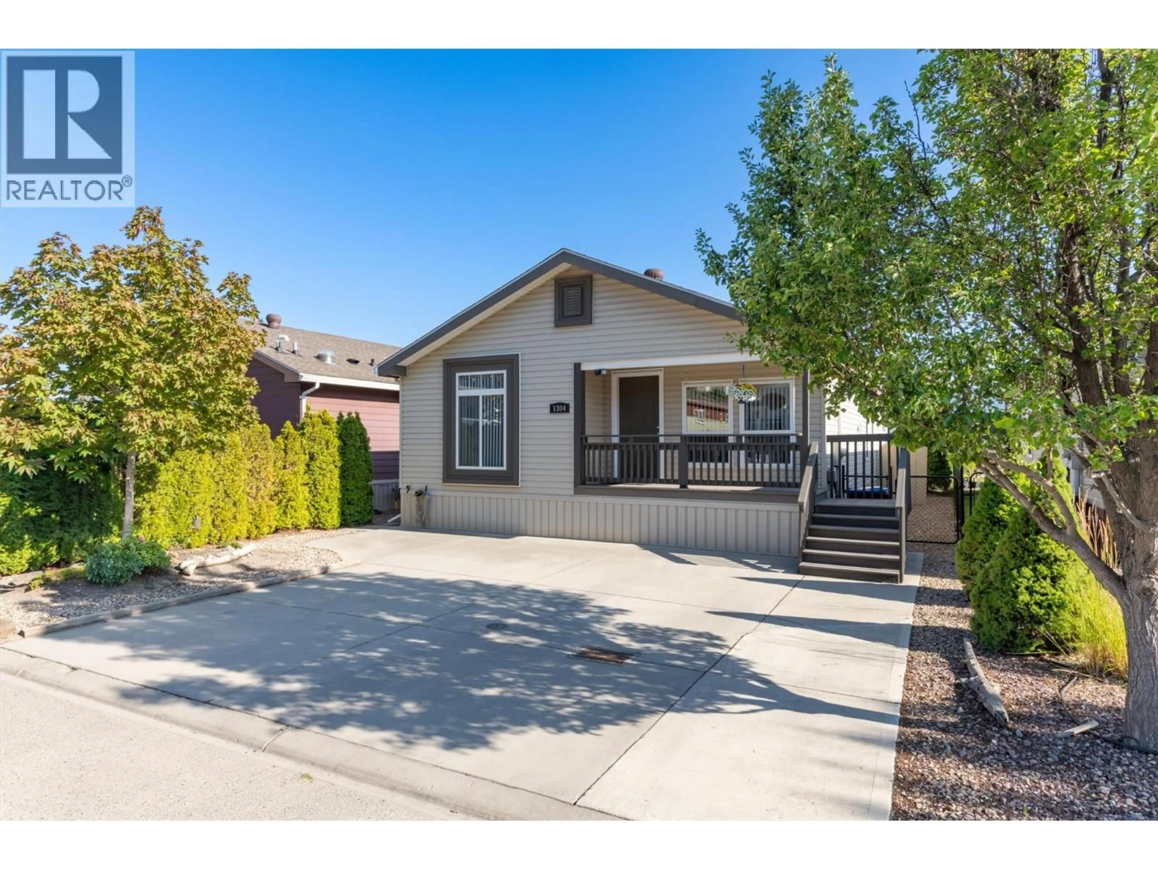 Home with vinyl exterior material, street for 1304 - 2440 OLD OKANAGAN HIGHWAY, West Kelowna British Columbia V4T3A2