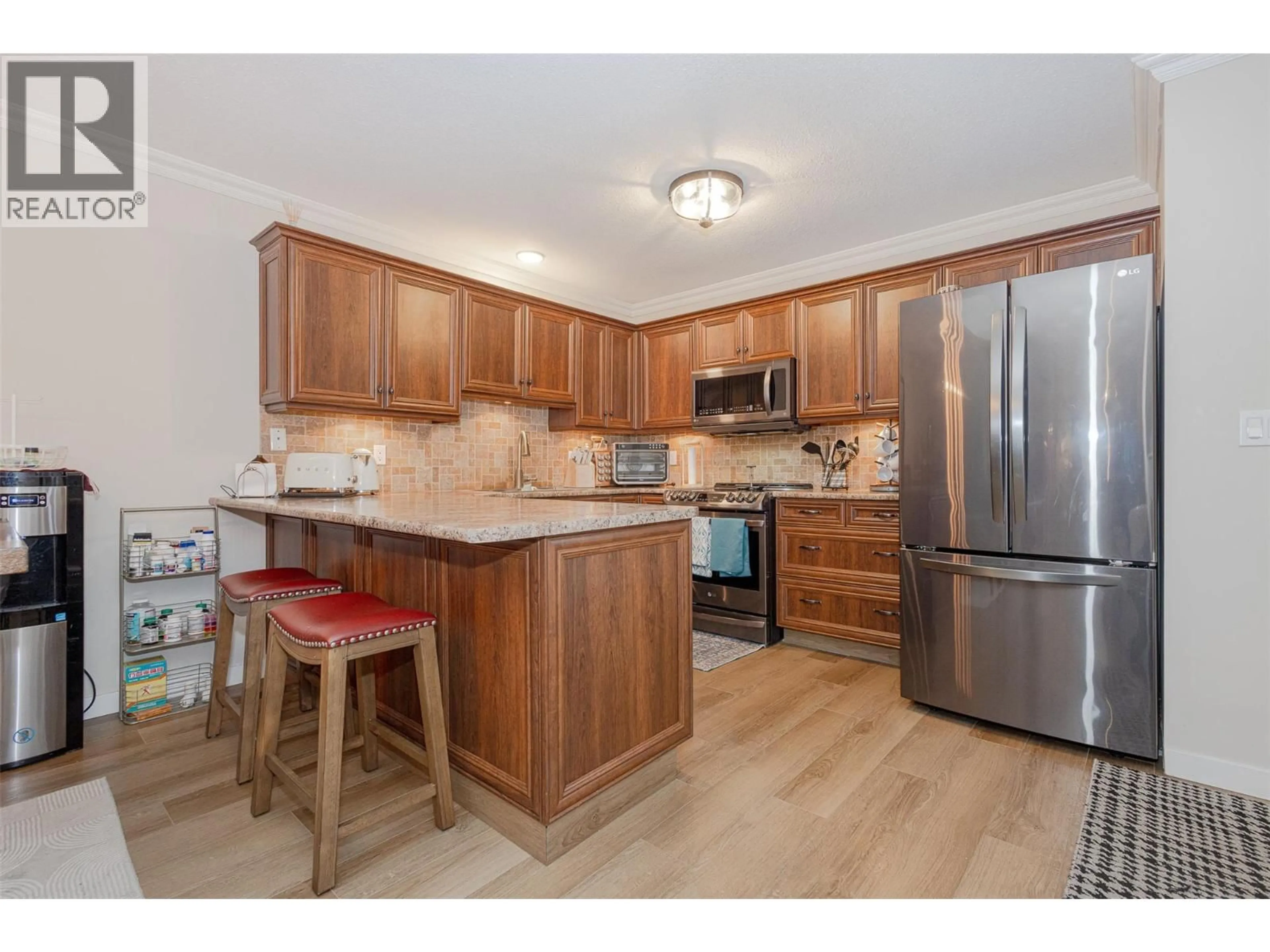 Standard kitchen, wood/laminate floor for 1 - 205 GERSTMAR ROAD, Kelowna British Columbia V1X4A6