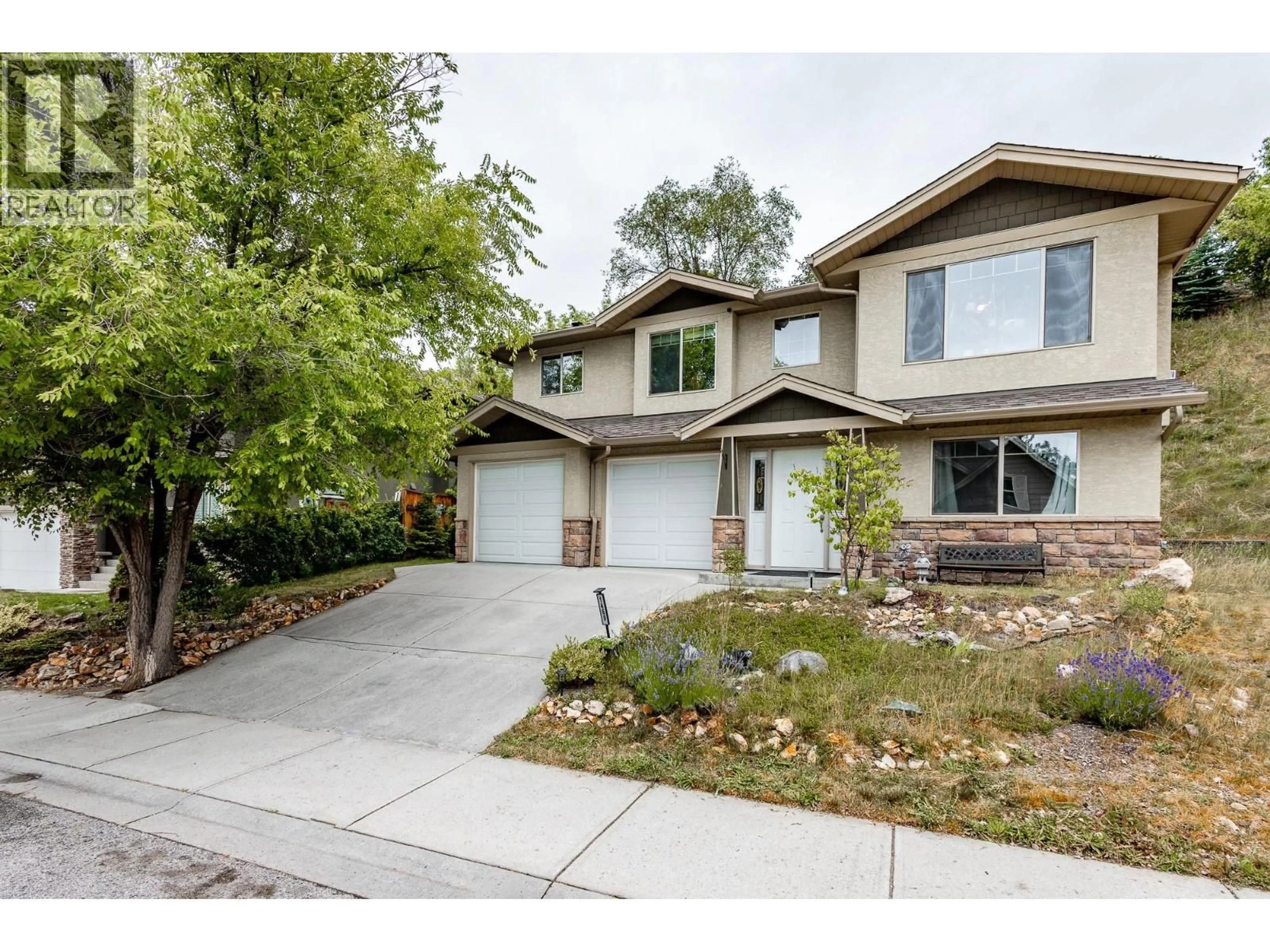 Home with vinyl exterior material, street for 1469 KLOPPENBURG ROAD, Kelowna British Columbia V1P1N6