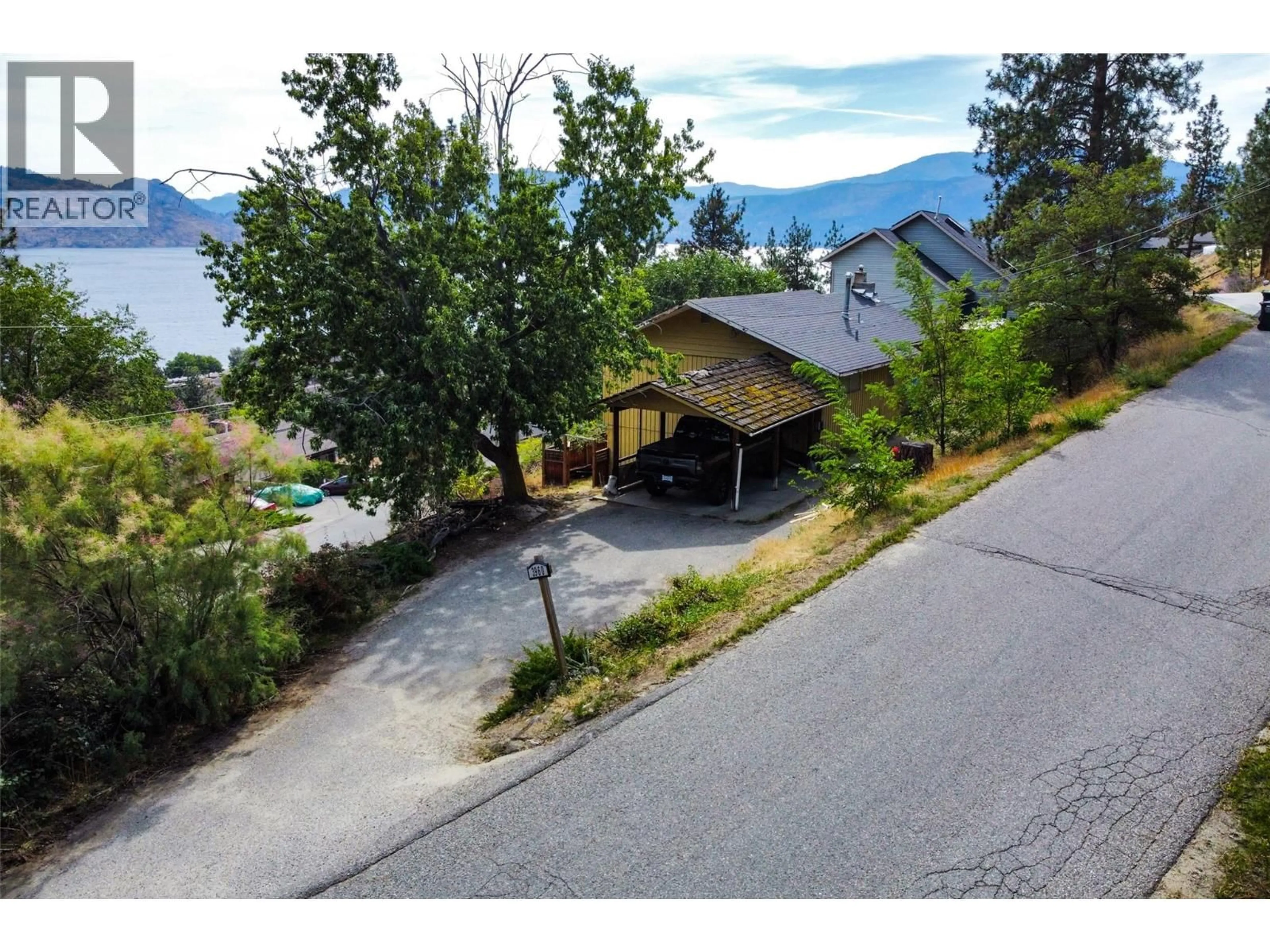 A pic from outside/outdoor area/front of a property/back of a property/a pic from drone, mountain view for 3960 DESERT PINES AVENUE, Peachland British Columbia V0H1X2