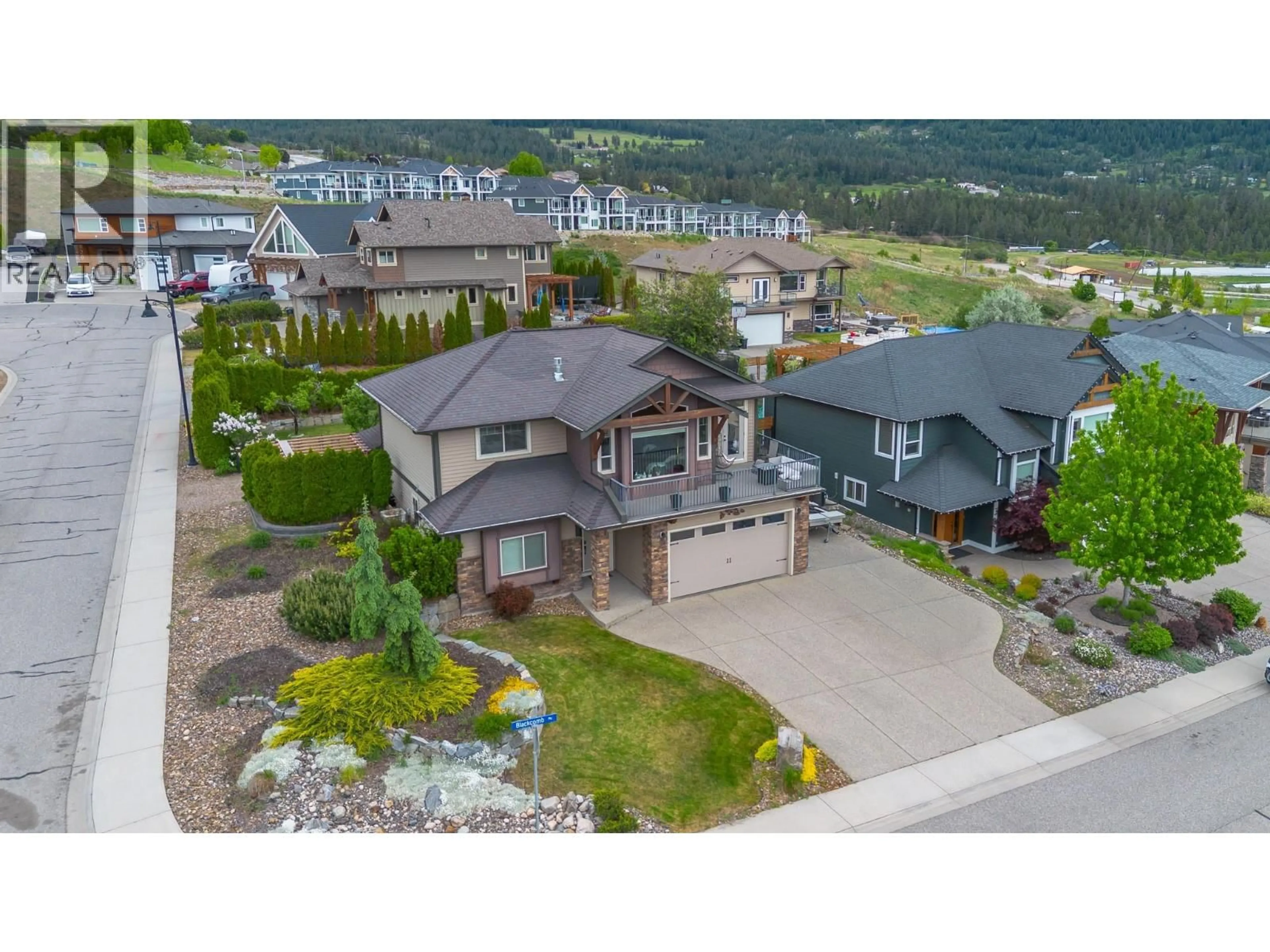 A pic from outside/outdoor area/front of a property/back of a property/a pic from drone, mountain view for 6555 BLACKCOMB PLACE, Vernon British Columbia