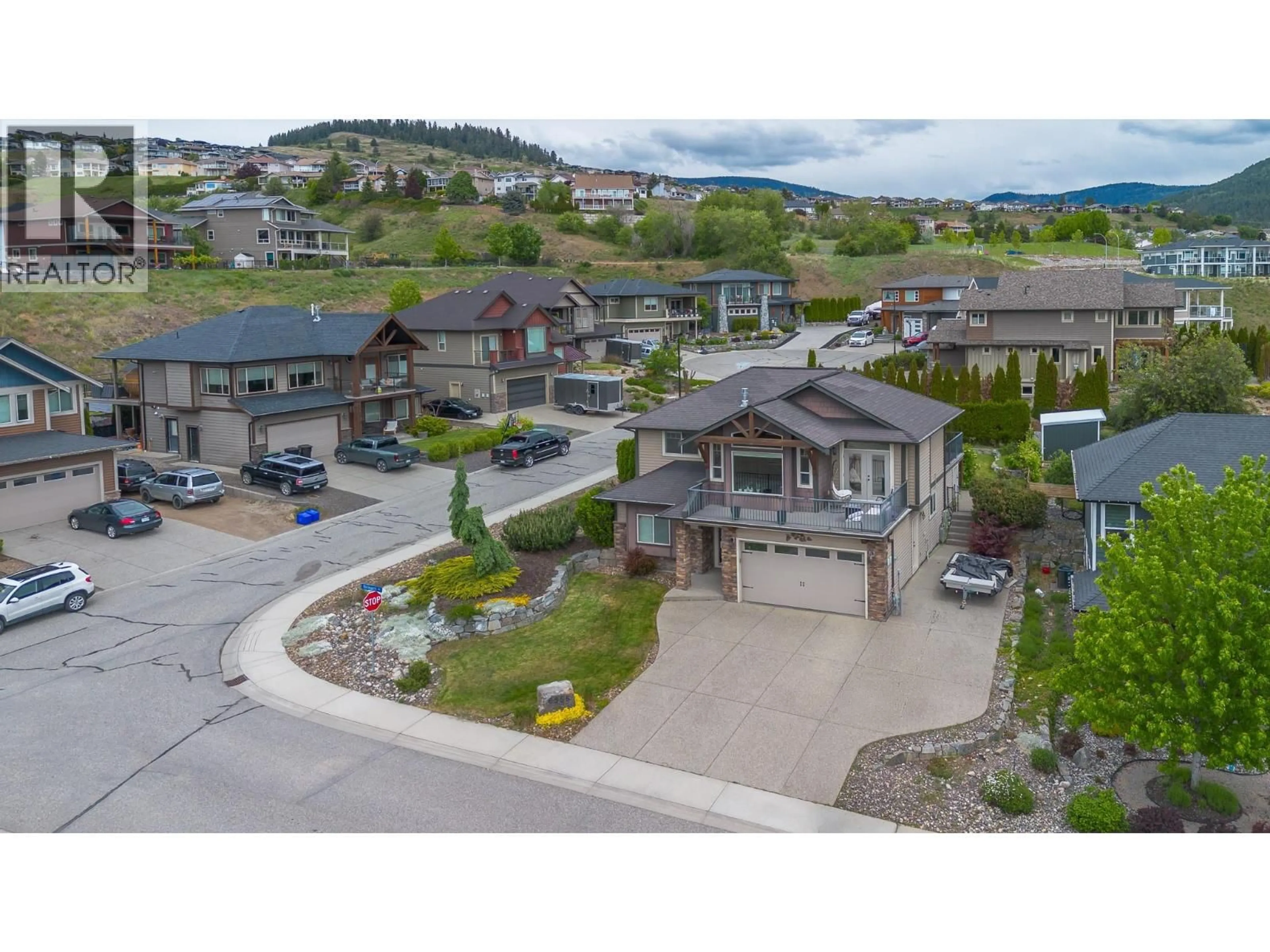 A pic from outside/outdoor area/front of a property/back of a property/a pic from drone, mountain view for 6555 BLACKCOMB PLACE, Vernon British Columbia