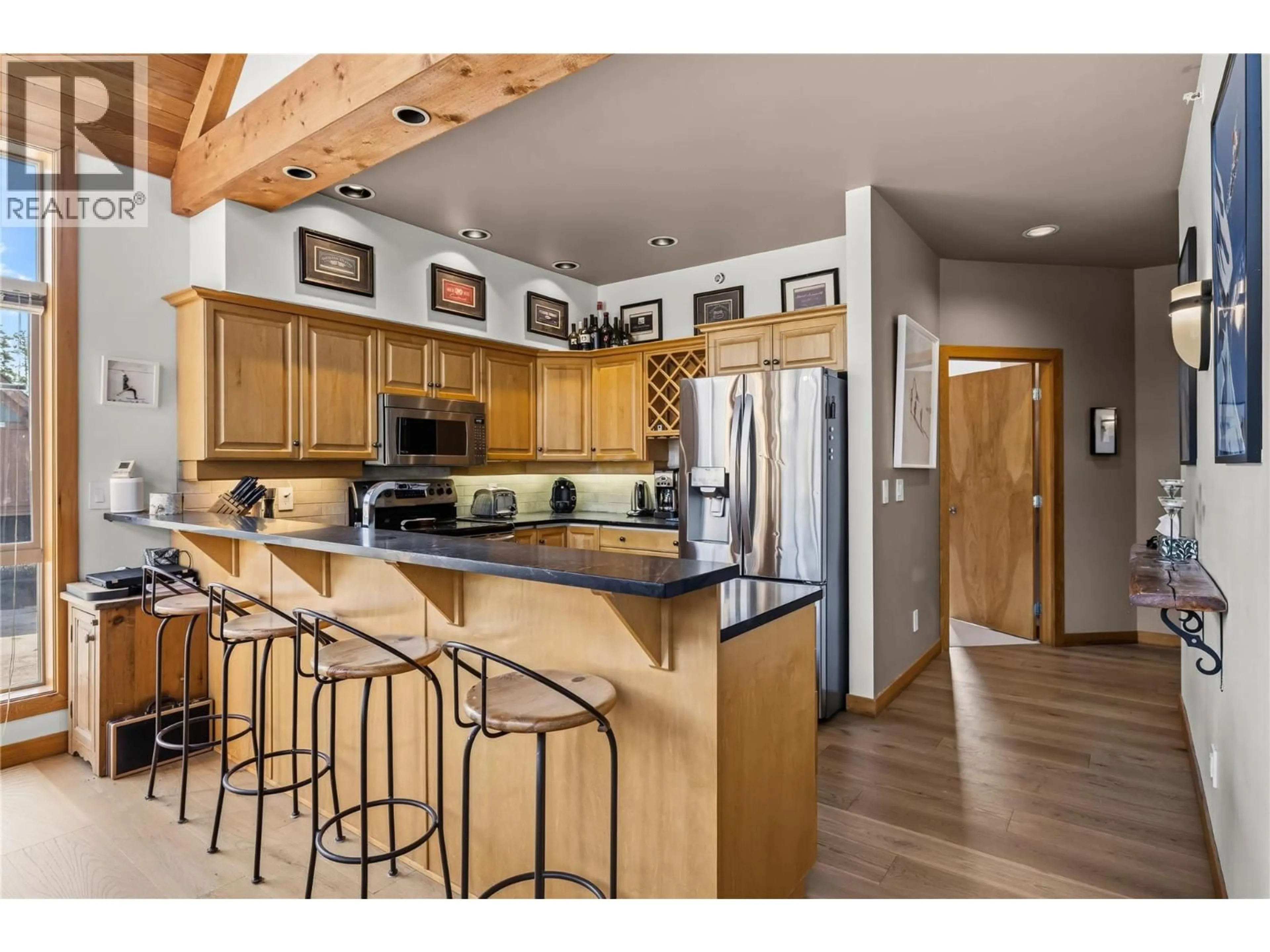 Open concept kitchen, wood/laminate floor for 22 - 165 KETTLE VIEW ROAD, Big White British Columbia V1P1P3