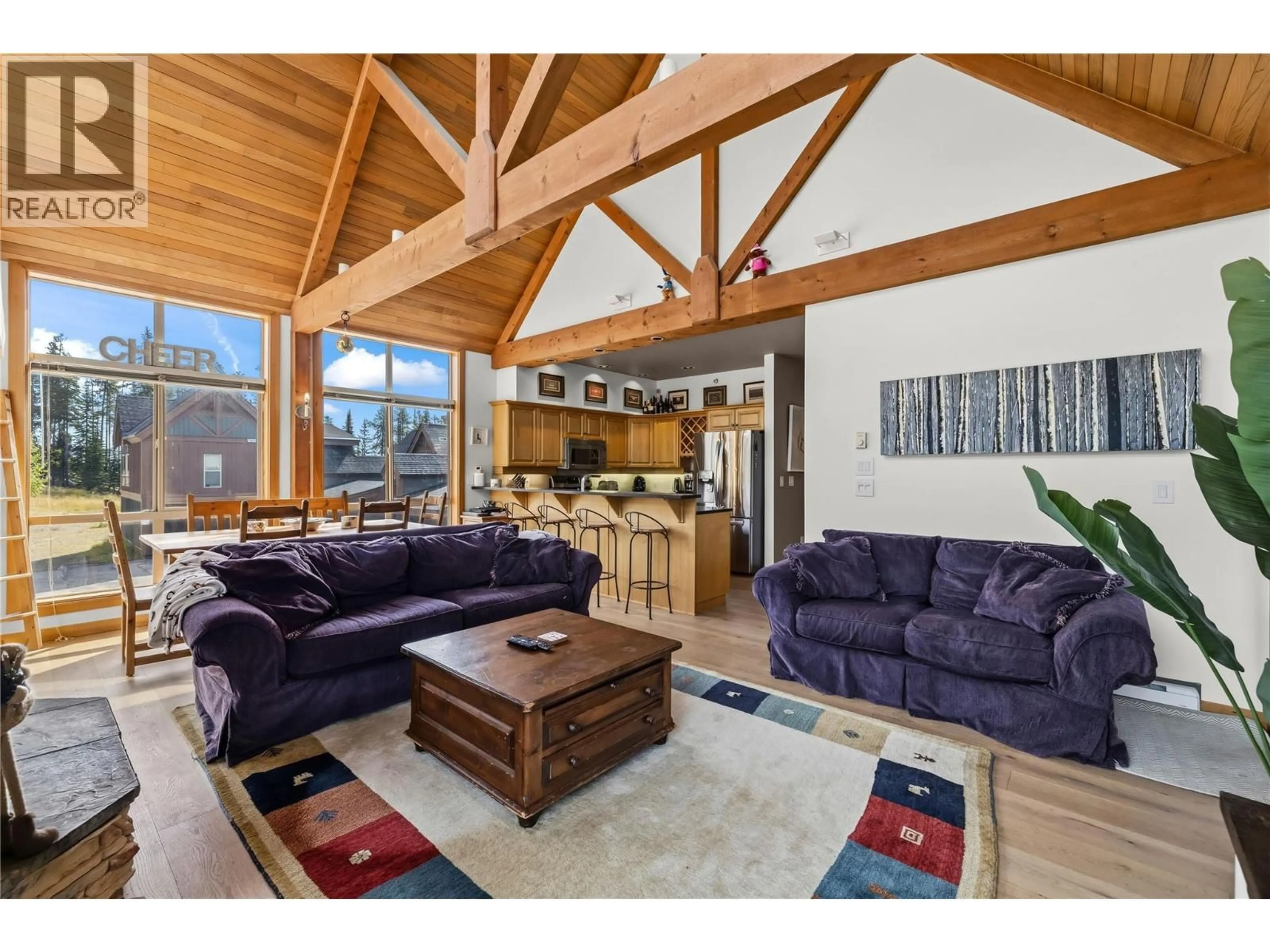 Living room with furniture, wood/laminate floor for 22 - 165 KETTLE VIEW ROAD, Big White British Columbia V1P1P3