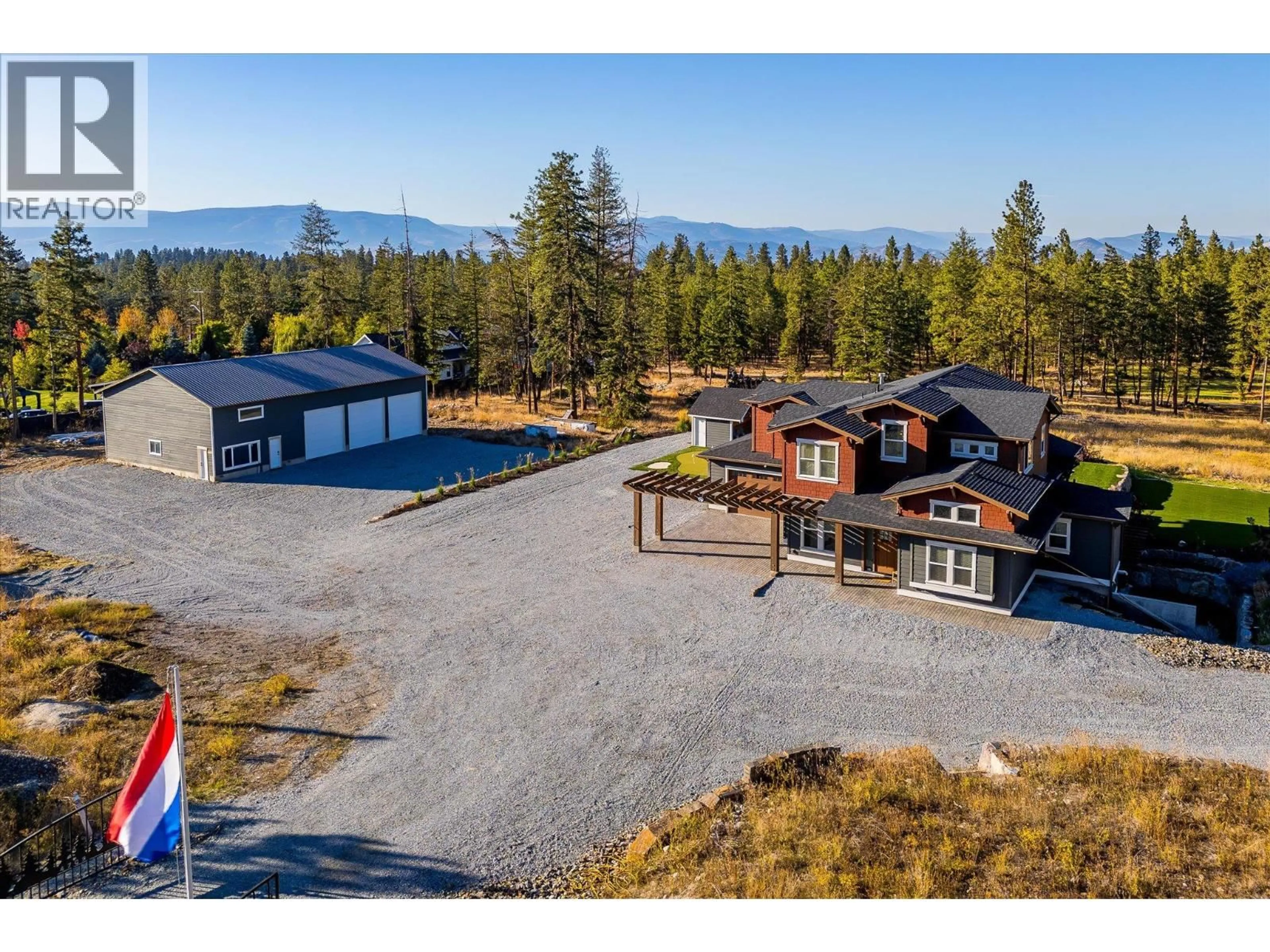 A pic from outside/outdoor area/front of a property/back of a property/a pic from drone, mountain view for 4702 MCCULLOCH ROAD, Kelowna British Columbia V1W4G1