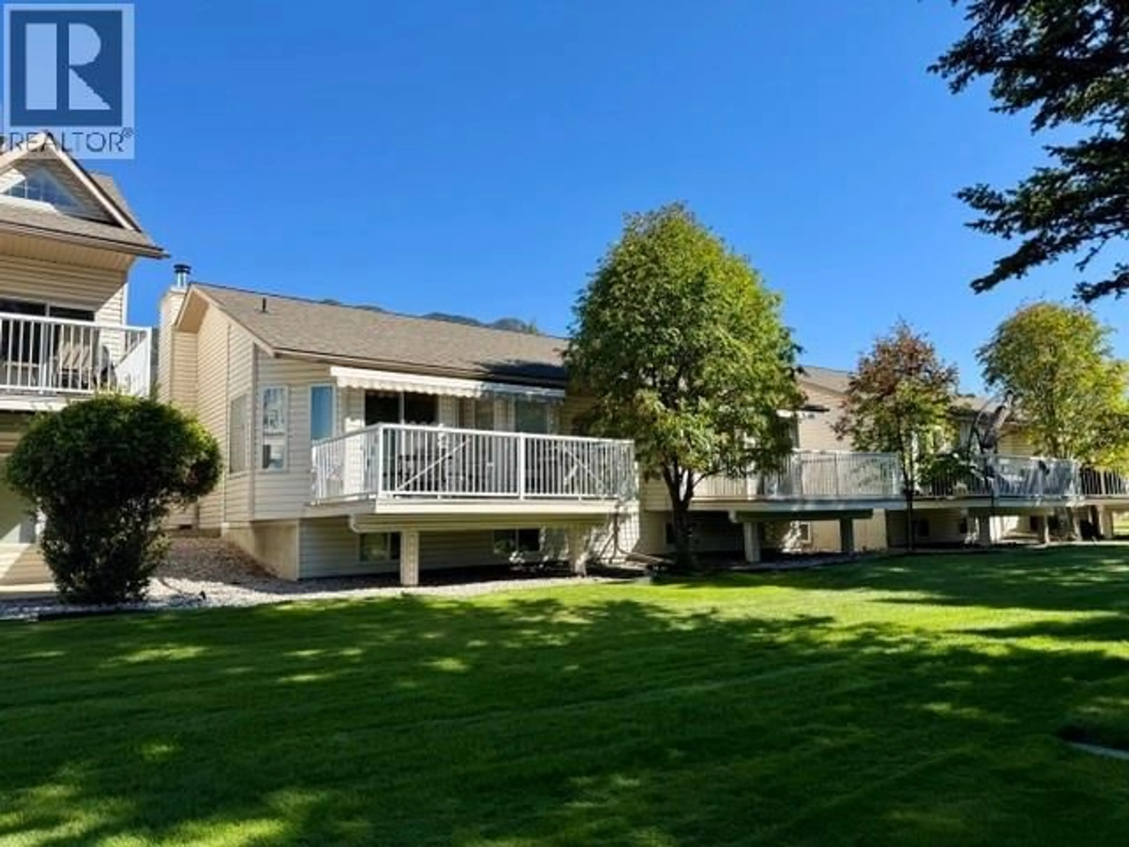 A pic from outside/outdoor area/front of a property/back of a property/a pic from drone, water/lake/river/ocean view for 4 - 7559 COLUMBIA AVENUE, Radium Hot Springs British Columbia V0A1M0
