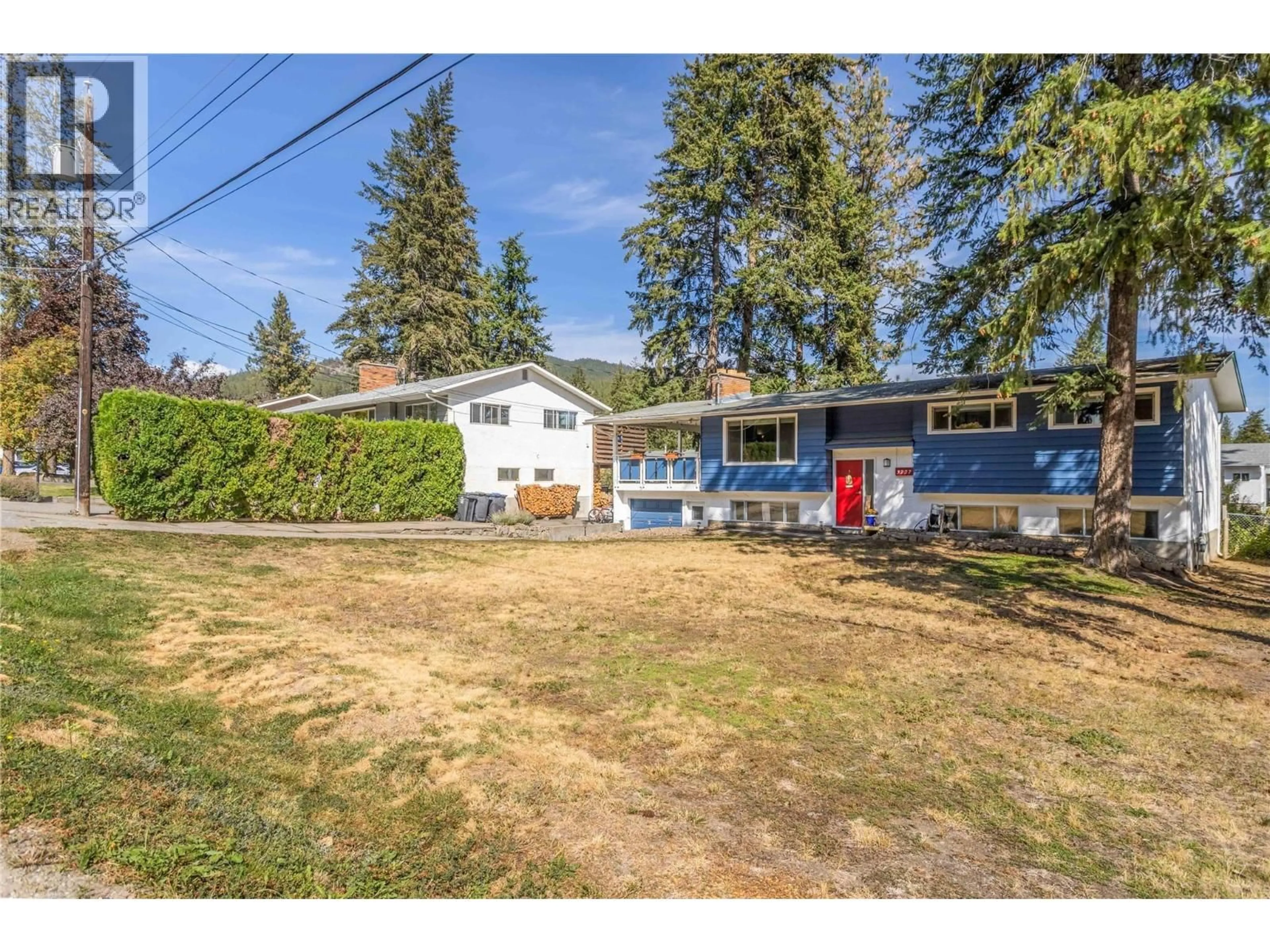 A pic from outside/outdoor area/front of a property/back of a property/a pic from drone, street for 3227 MCIVER ROAD, West Kelowna British Columbia V4T1G1