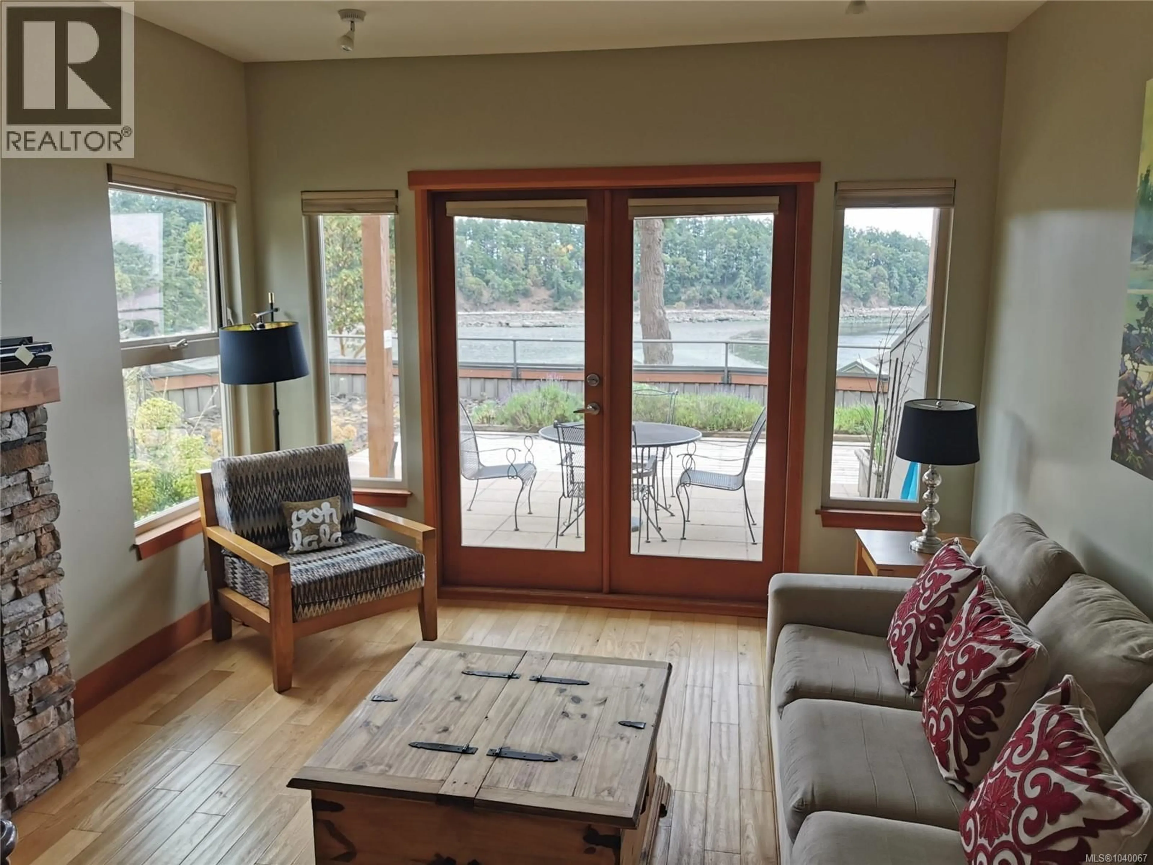 Living room with furniture, wood/laminate floor for 13 - 494 ARBUTUS DRIVE, Mayne Island British Columbia V0N2J2