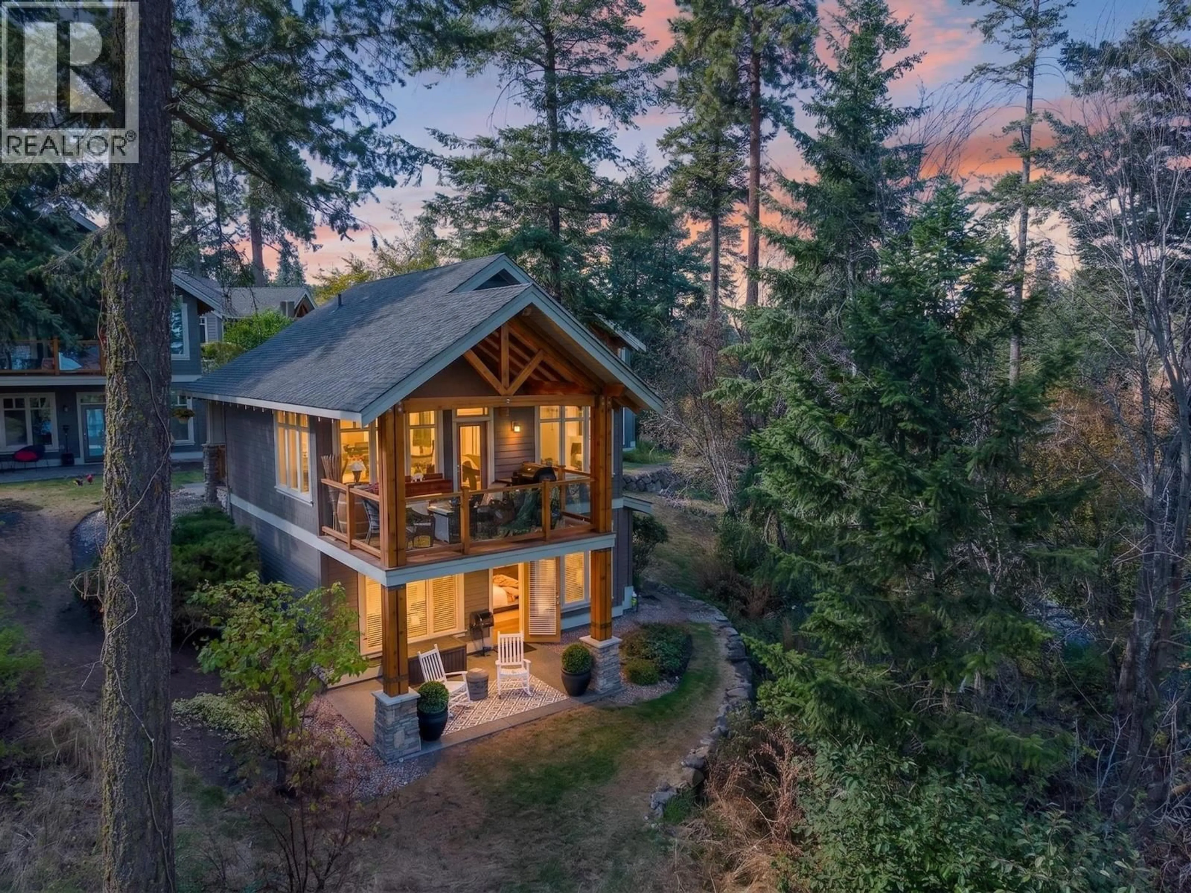 A pic from outside/outdoor area/front of a property/back of a property/a pic from drone, forest/trees view for 41 - 251 PREDATOR RIDGE DRIVE, Vernon British Columbia V1H1V3