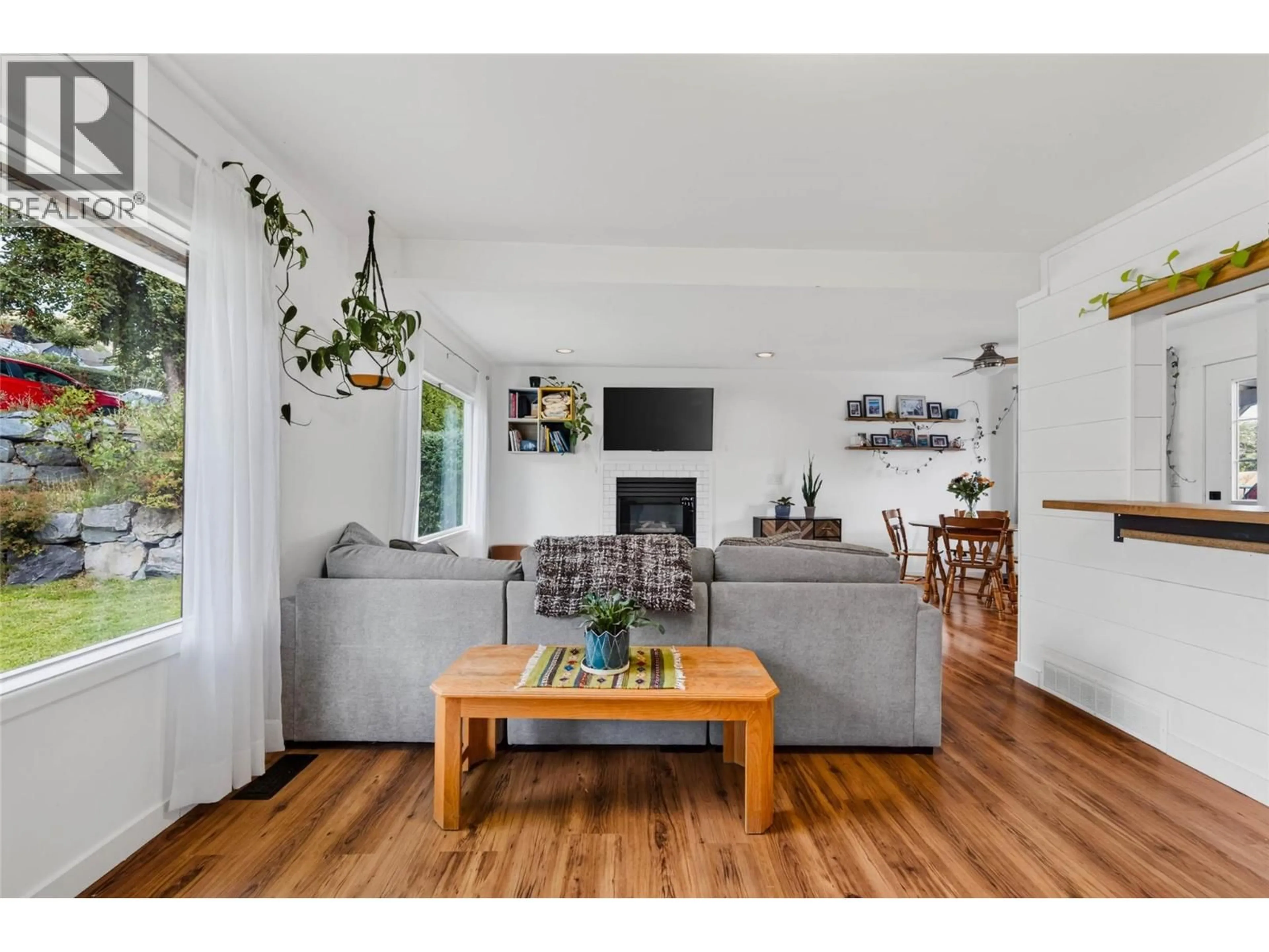 Living room with furniture, wood/laminate floor for 660 DICKENS STREET, Warfield British Columbia V1R2B6