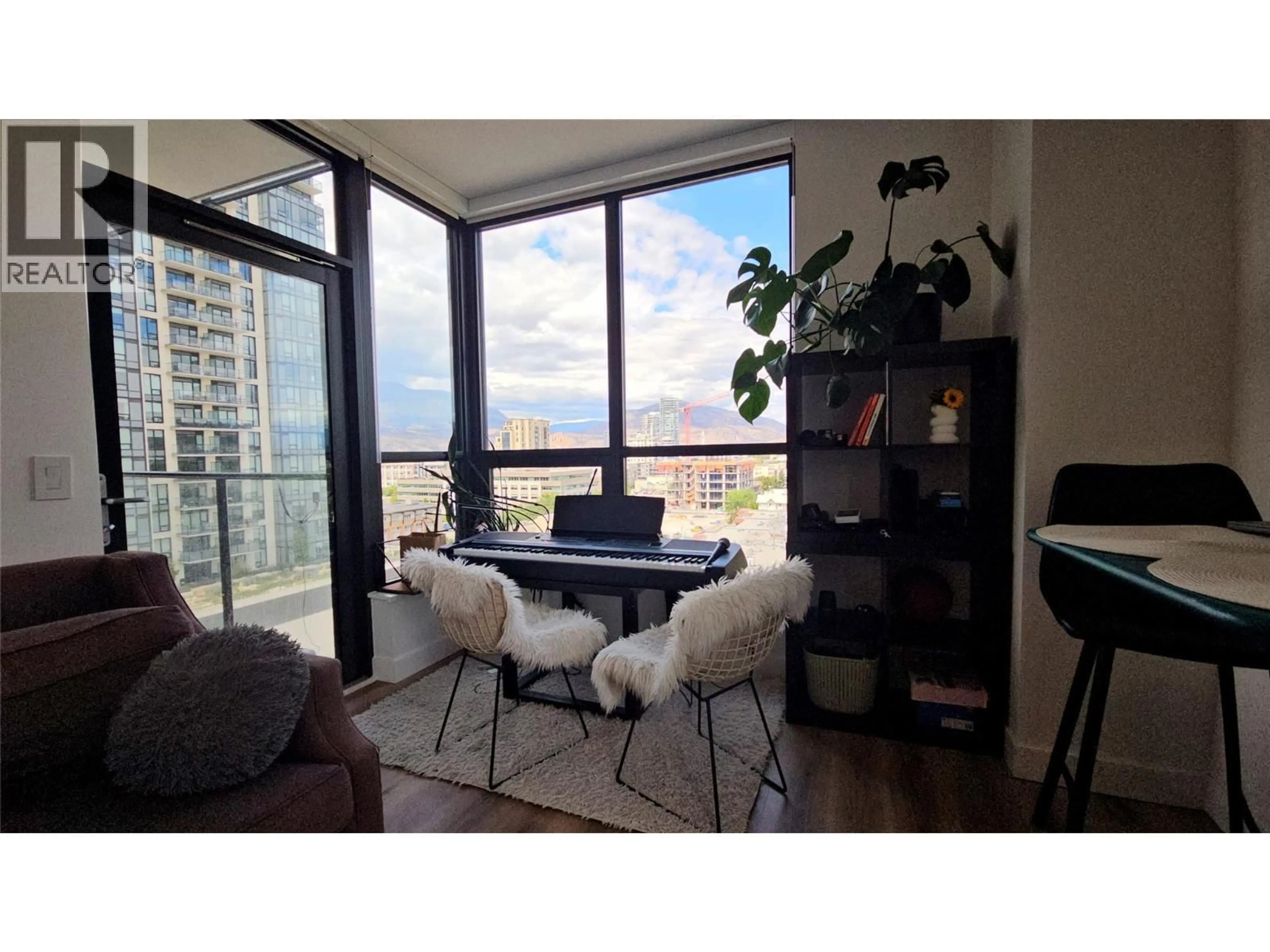 Living room with furniture, wood/laminate floor for 1008 - 1488 BERTRAM STREET, Kelowna British Columbia V1Y0M6