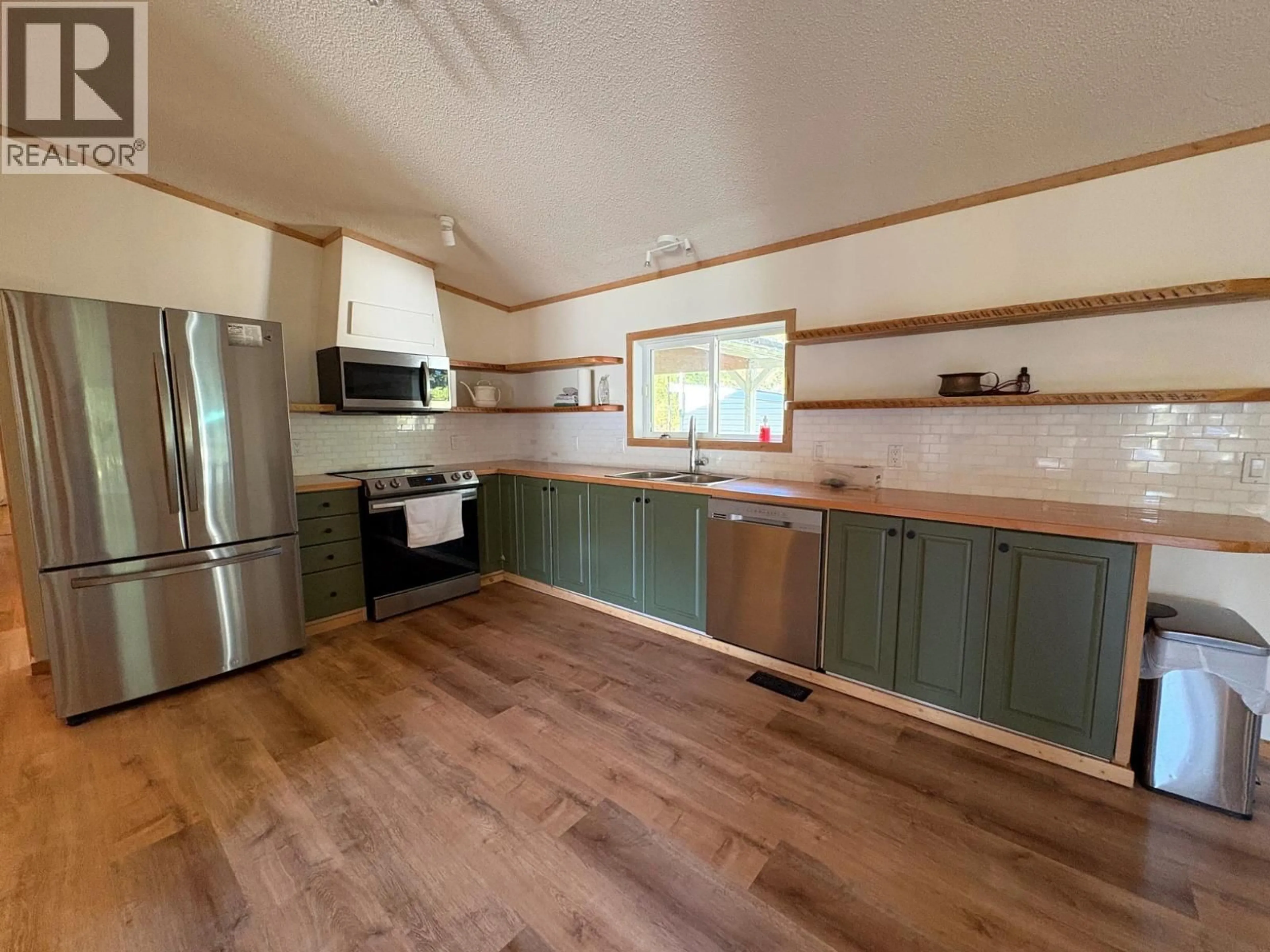 Open concept kitchen, wood/laminate floor for 237 DUNLEVY ROAD, Clearwater British Columbia V0E1N2
