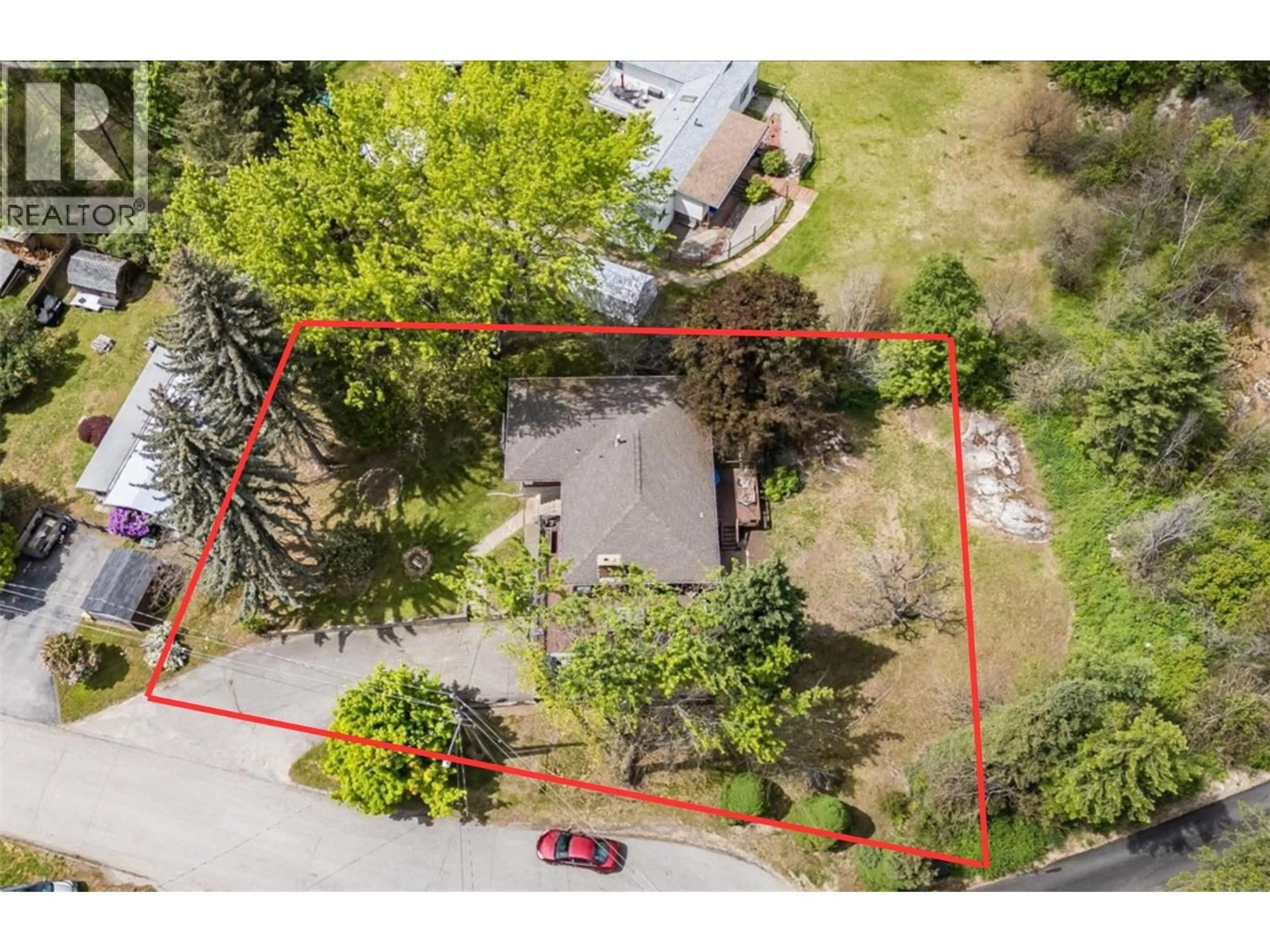 A pic from outside/outdoor area/front of a property/back of a property/a pic from drone, street for 1106 CLARKE ROAD, Robson British Columbia V0G1X0