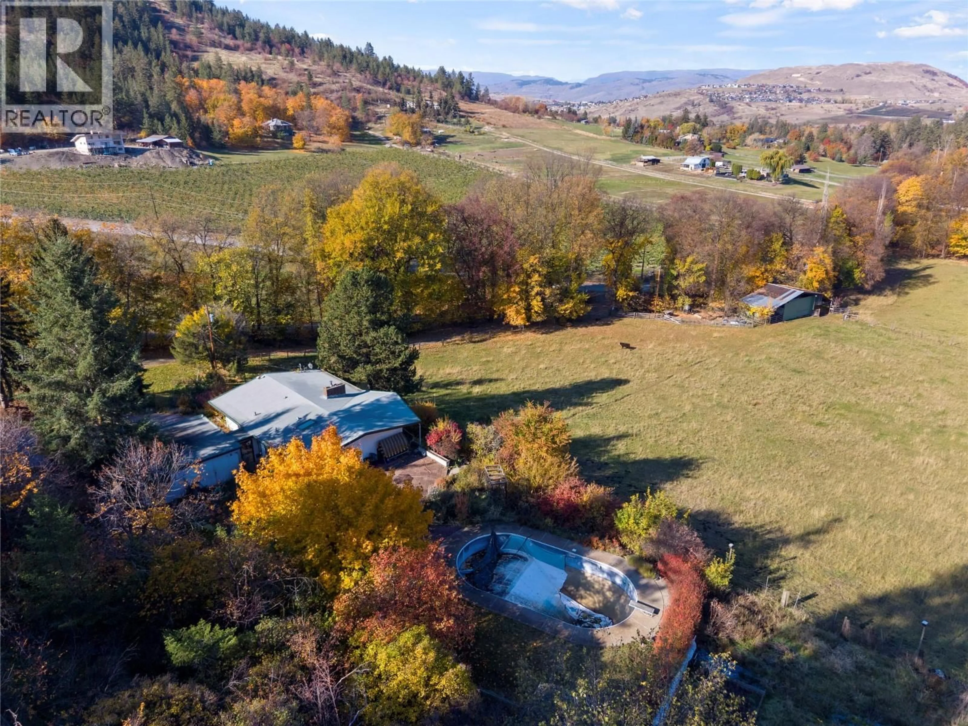 A pic from outside/outdoor area/front of a property/back of a property/a pic from drone, mountain view for 6709 COSENS BAY ROAD, Coldstream British Columbia V1B1N7