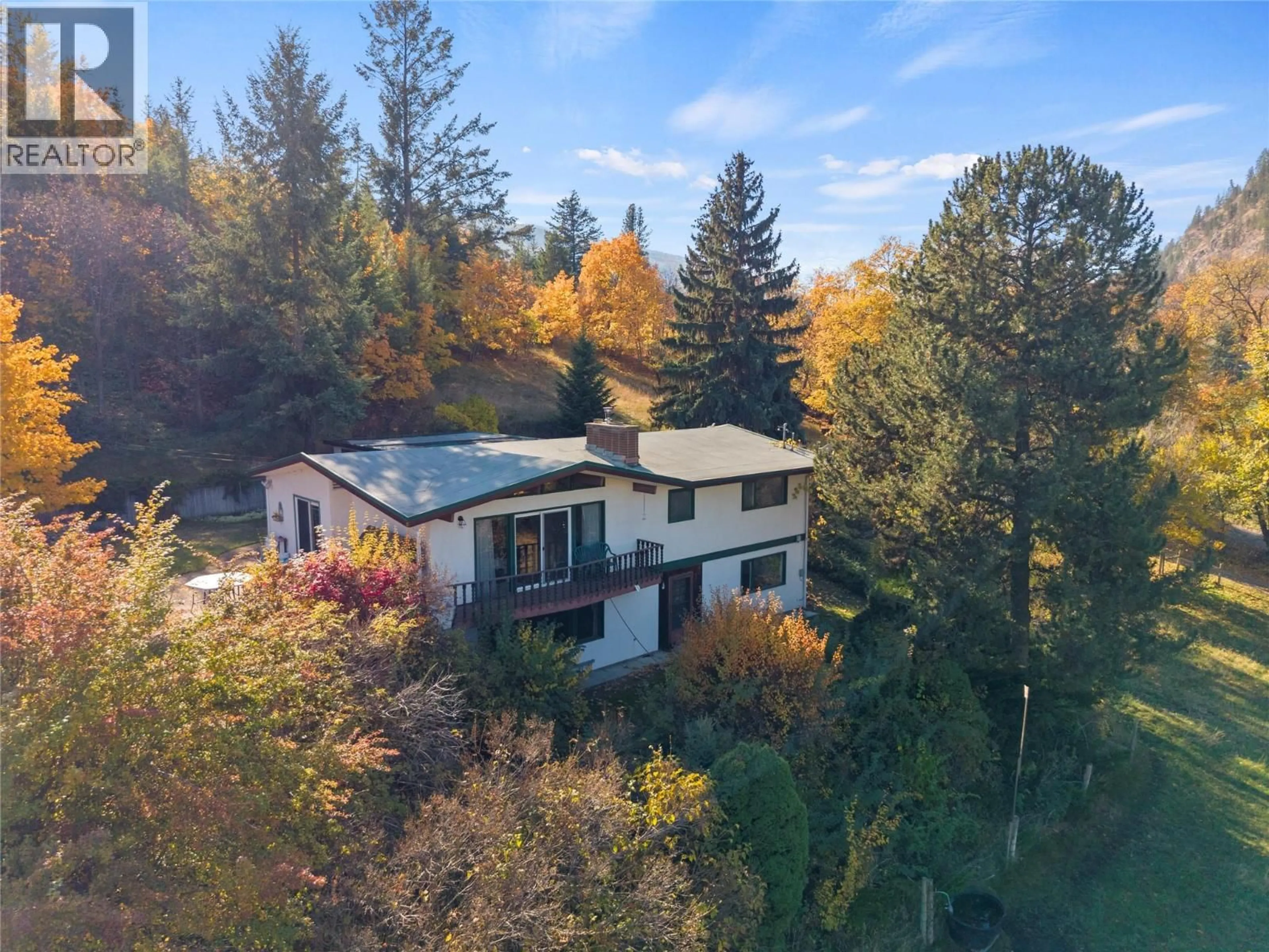 A pic from outside/outdoor area/front of a property/back of a property/a pic from drone, forest/trees view for 6709 COSENS BAY ROAD, Coldstream British Columbia V1B1N7