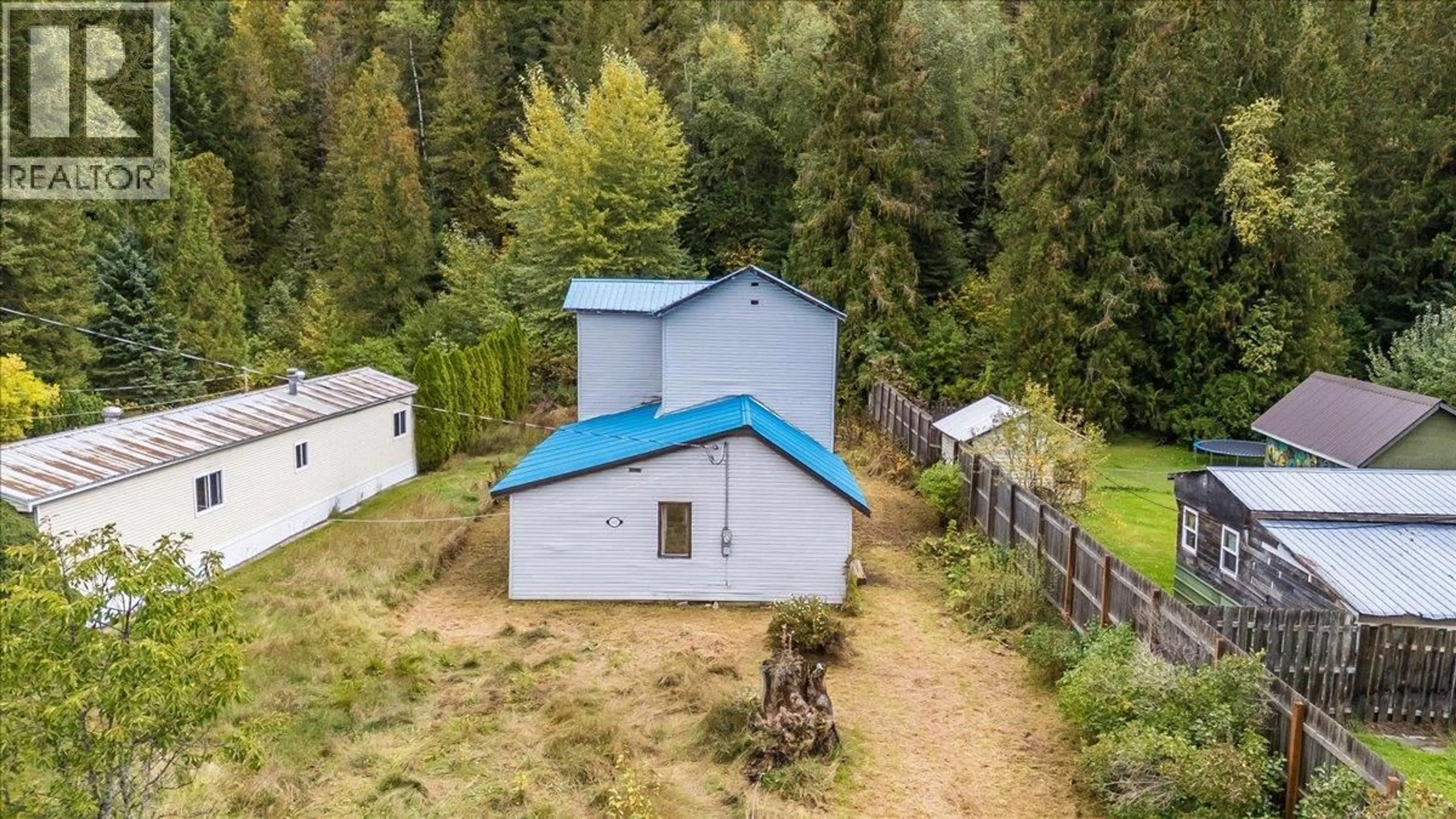 A pic from outside/outdoor area/front of a property/back of a property/a pic from drone, forest/trees view for 1427 AIRPORT ROAD, Salmo British Columbia V0G1Z0