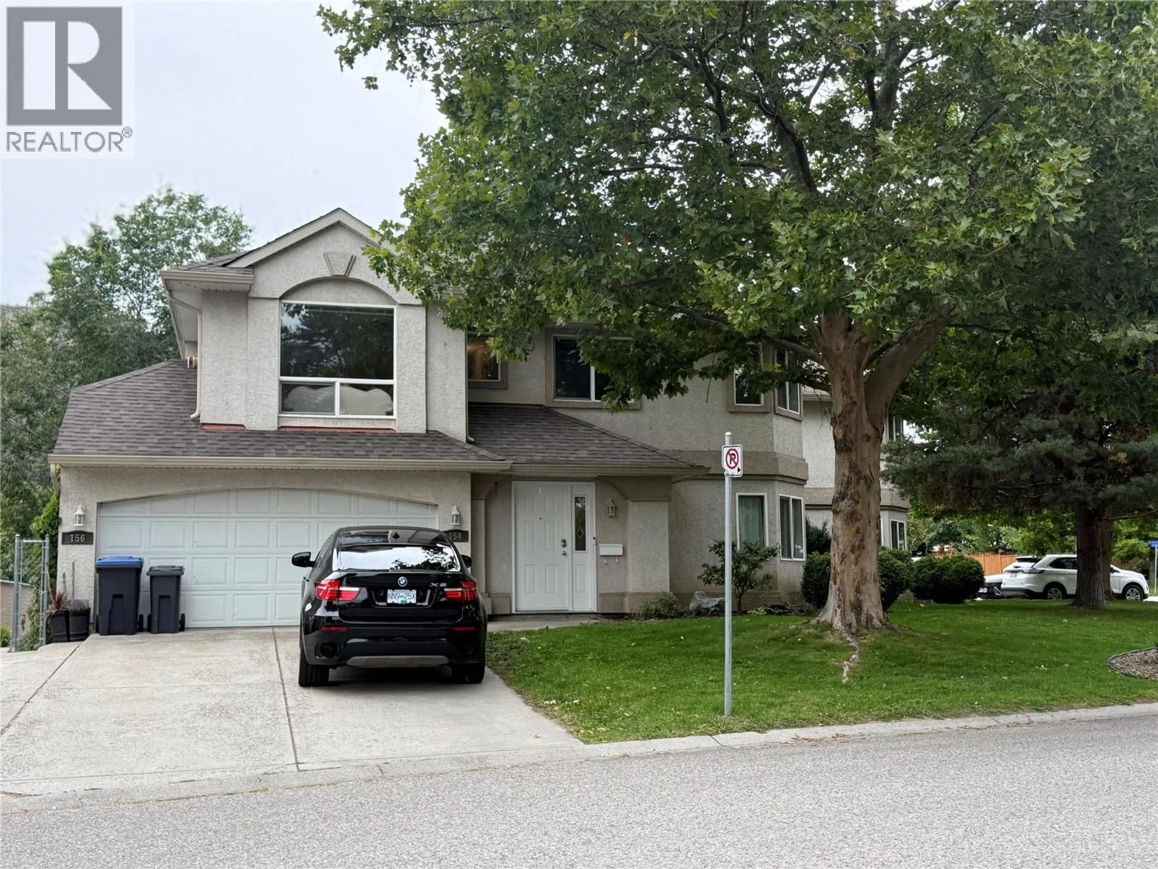 Home with vinyl exterior material, street for 154 RITCHIE COURT, Kelowna British Columbia V1V1Z2