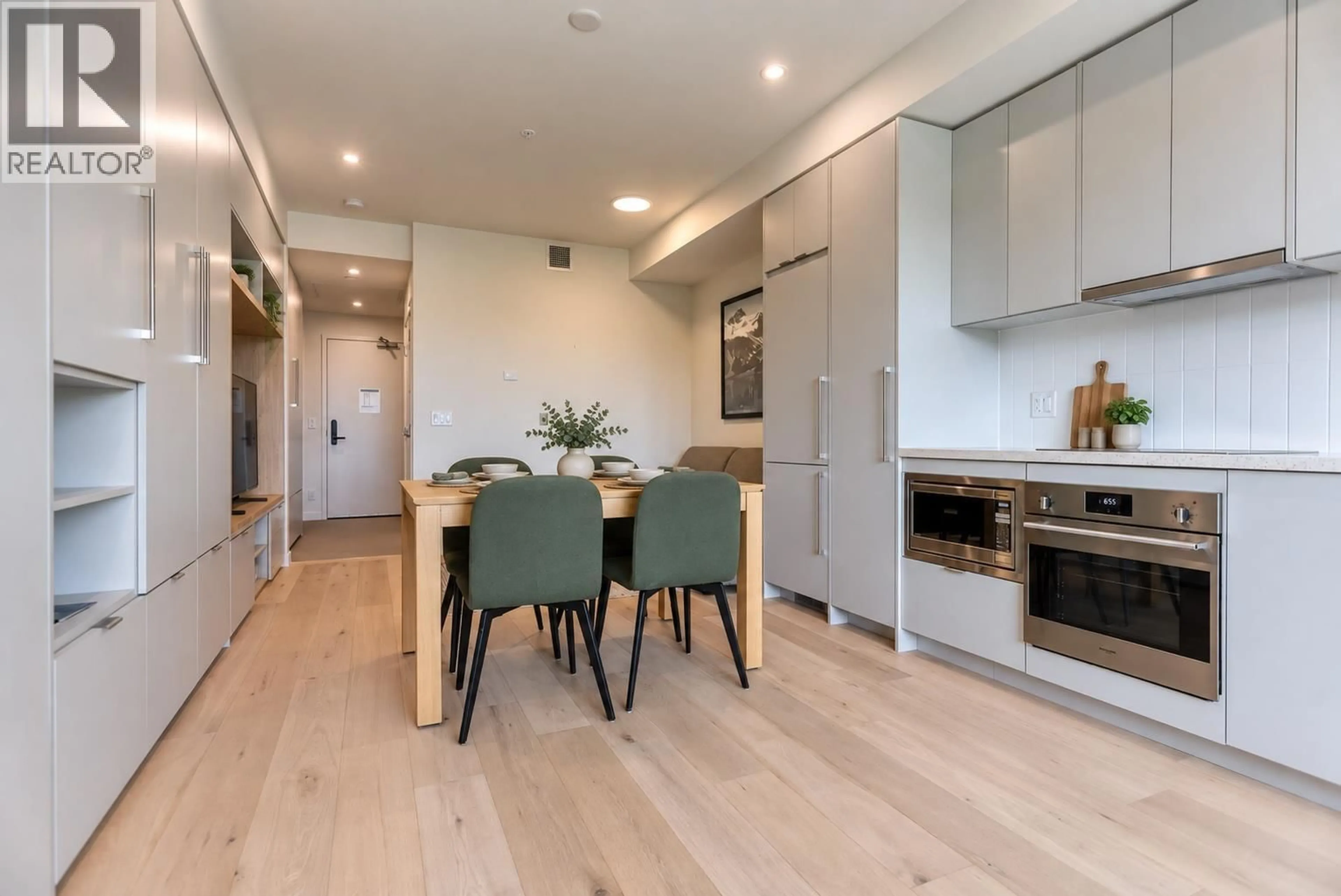 Open concept kitchen, wood/laminate floor for 319 - 4280 RED MOUNTAIN ROAD, Rossland British Columbia V0G1Y0