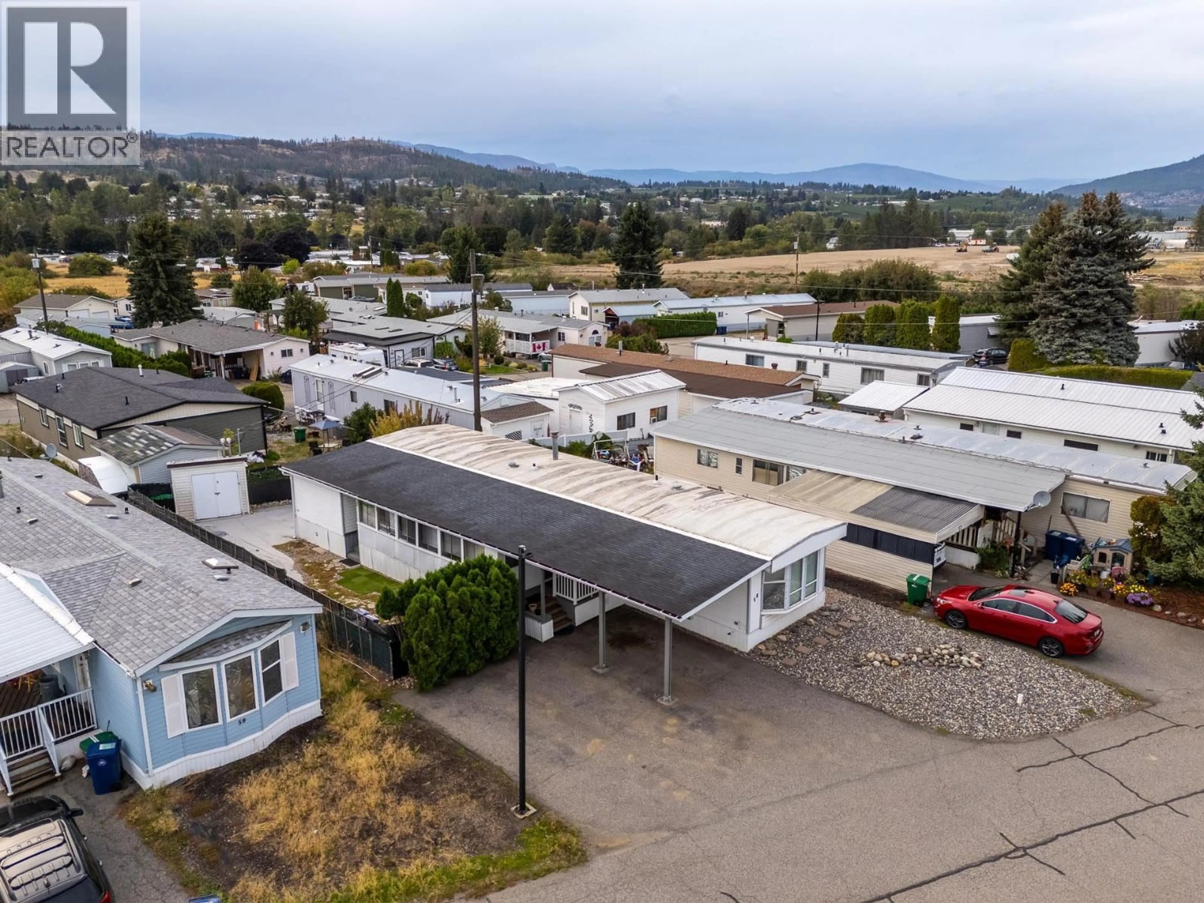 A pic from outside/outdoor area/front of a property/back of a property/a pic from drone, mountain view for 58 - 9020 JIM BAILEY ROAD, Kelowna British Columbia V4V1E5
