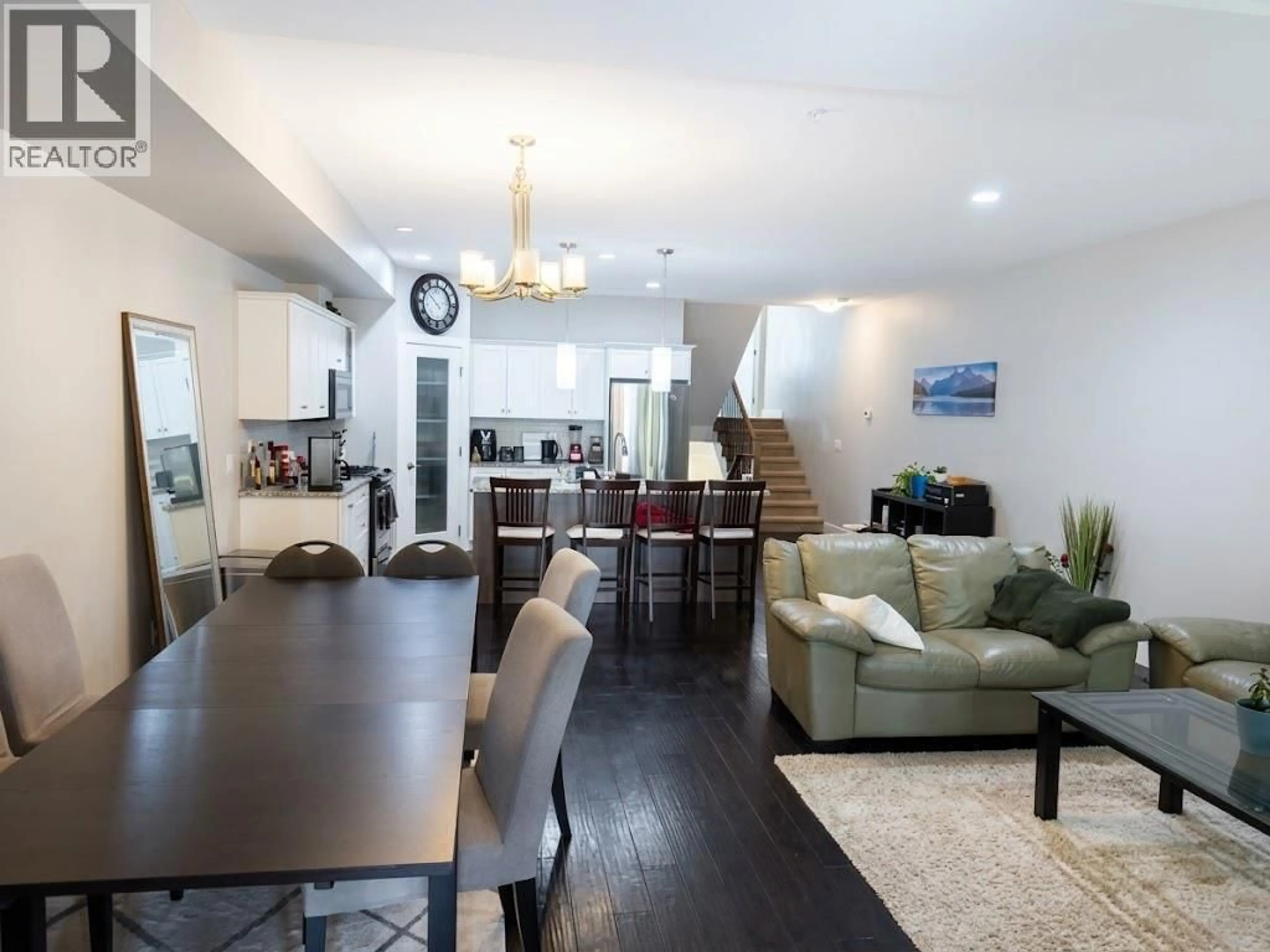 Living room with furniture, wood/laminate floor for 18 - 600 BOYNTON PLACE, Kelowna British Columbia V1V3B8