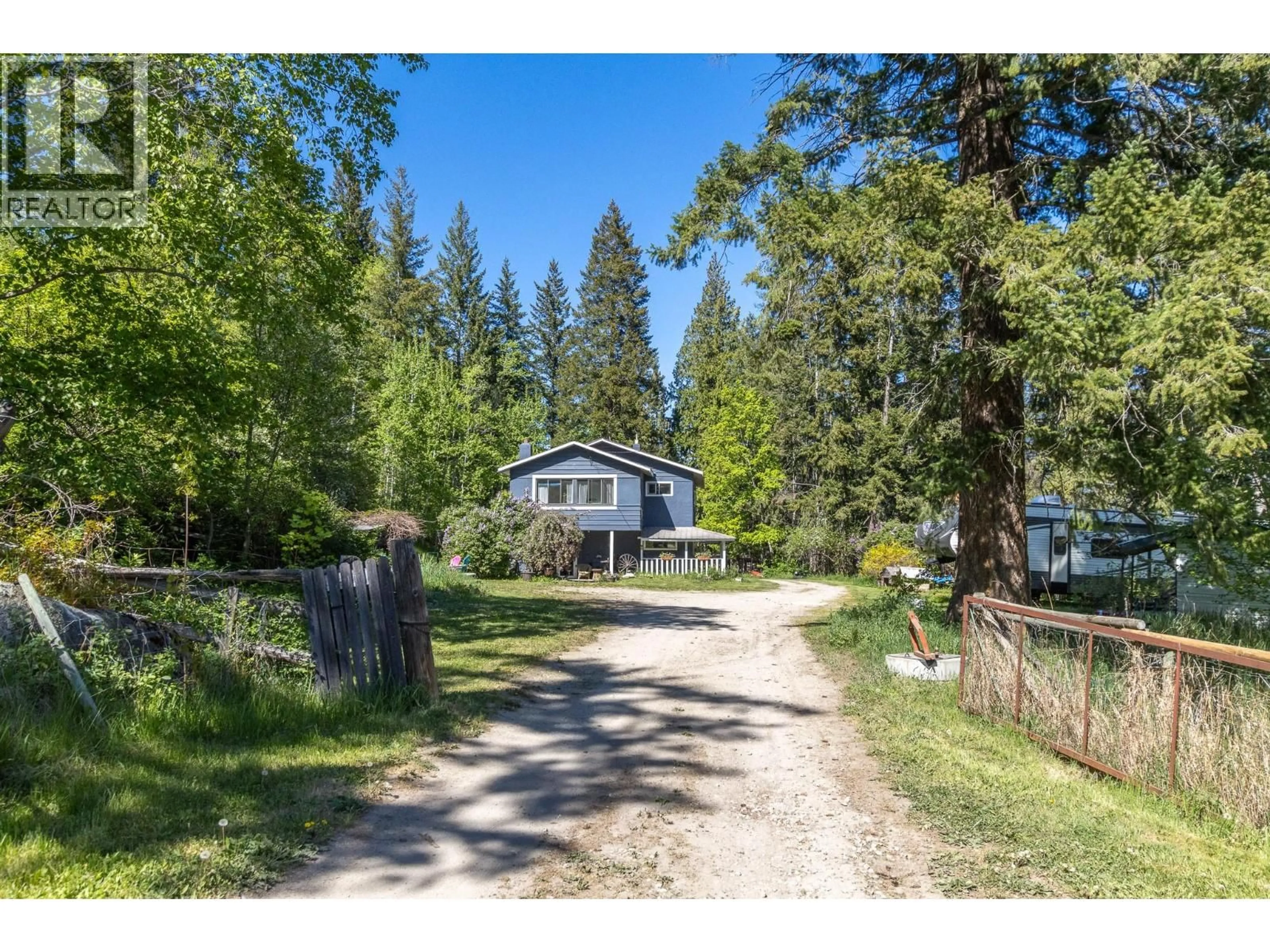 A pic from outside/outdoor area/front of a property/back of a property/a pic from drone, forest/trees view for 3591 65 AVENUE NORTHWEST, Salmon Arm British Columbia V1E3A2
