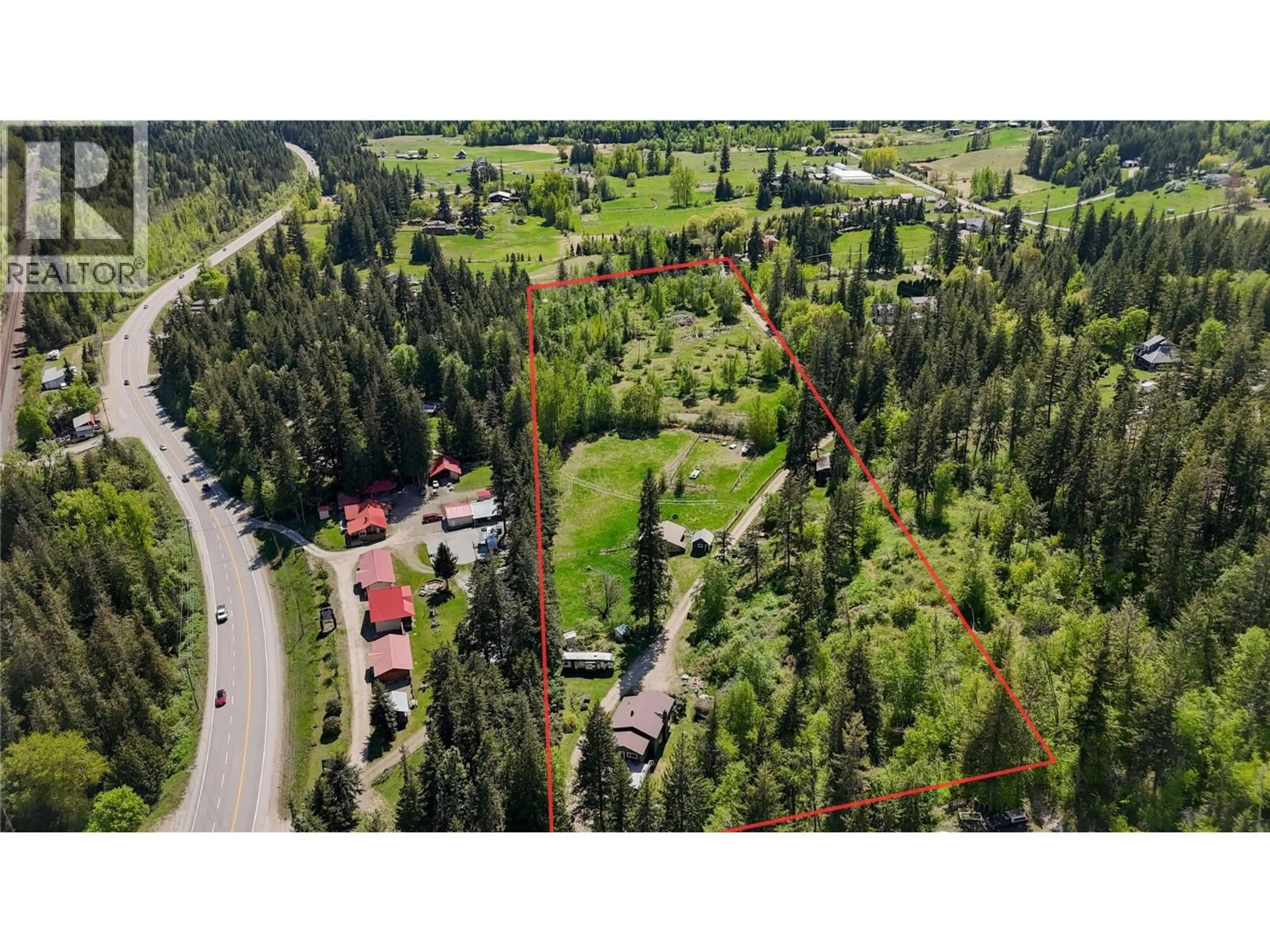 A pic from outside/outdoor area/front of a property/back of a property/a pic from drone, forest/trees view for 3591 65 AVENUE NORTHWEST, Salmon Arm British Columbia V1E3A2
