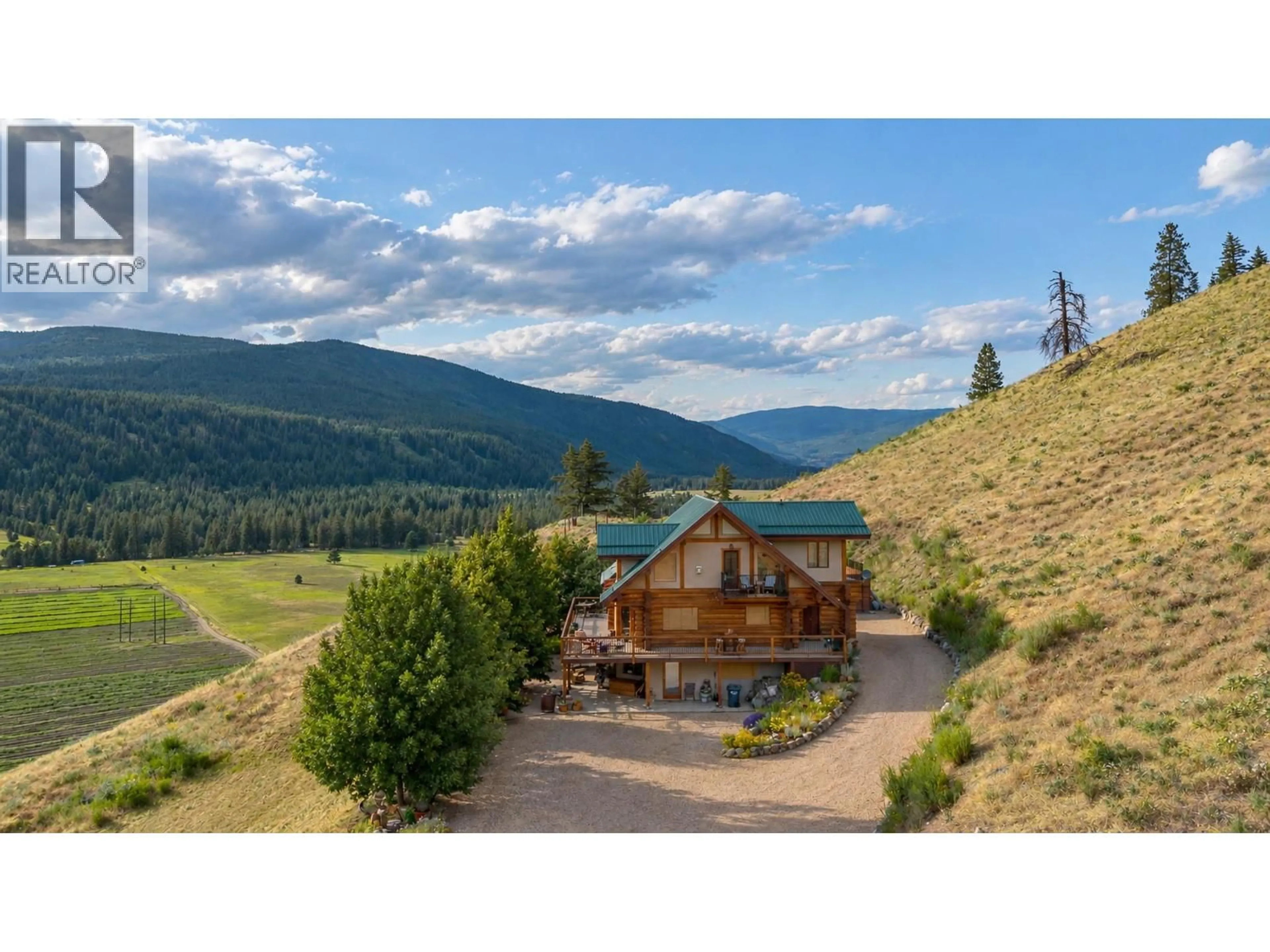 A pic from outside/outdoor area/front of a property/back of a property/a pic from drone, mountain view for 1225 ROUND LAKE ROAD, Armstrong British Columbia V0E1B5
