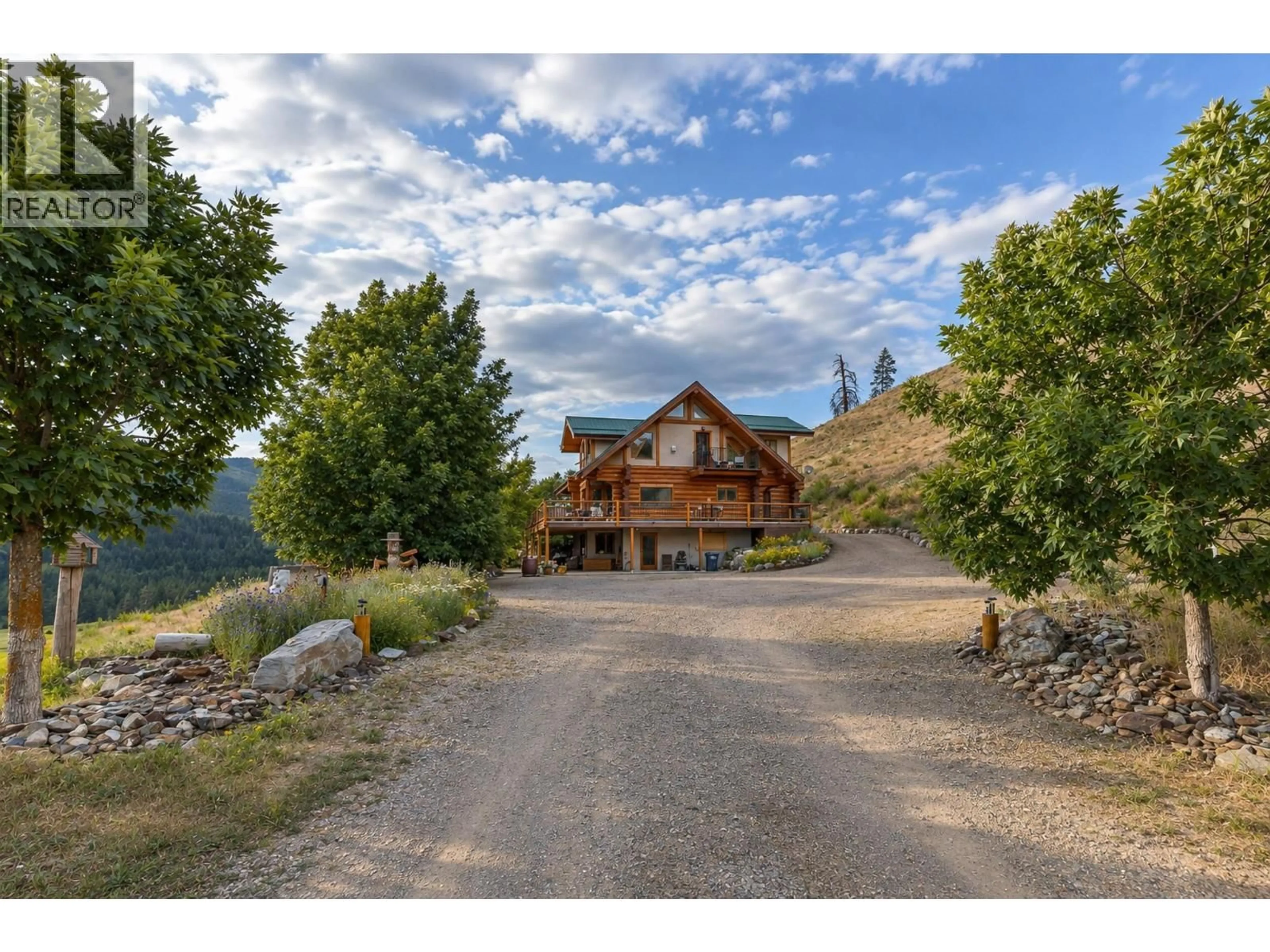 A pic from outside/outdoor area/front of a property/back of a property/a pic from drone, mountain view for 1225 ROUND LAKE ROAD, Armstrong British Columbia V0E1B5
