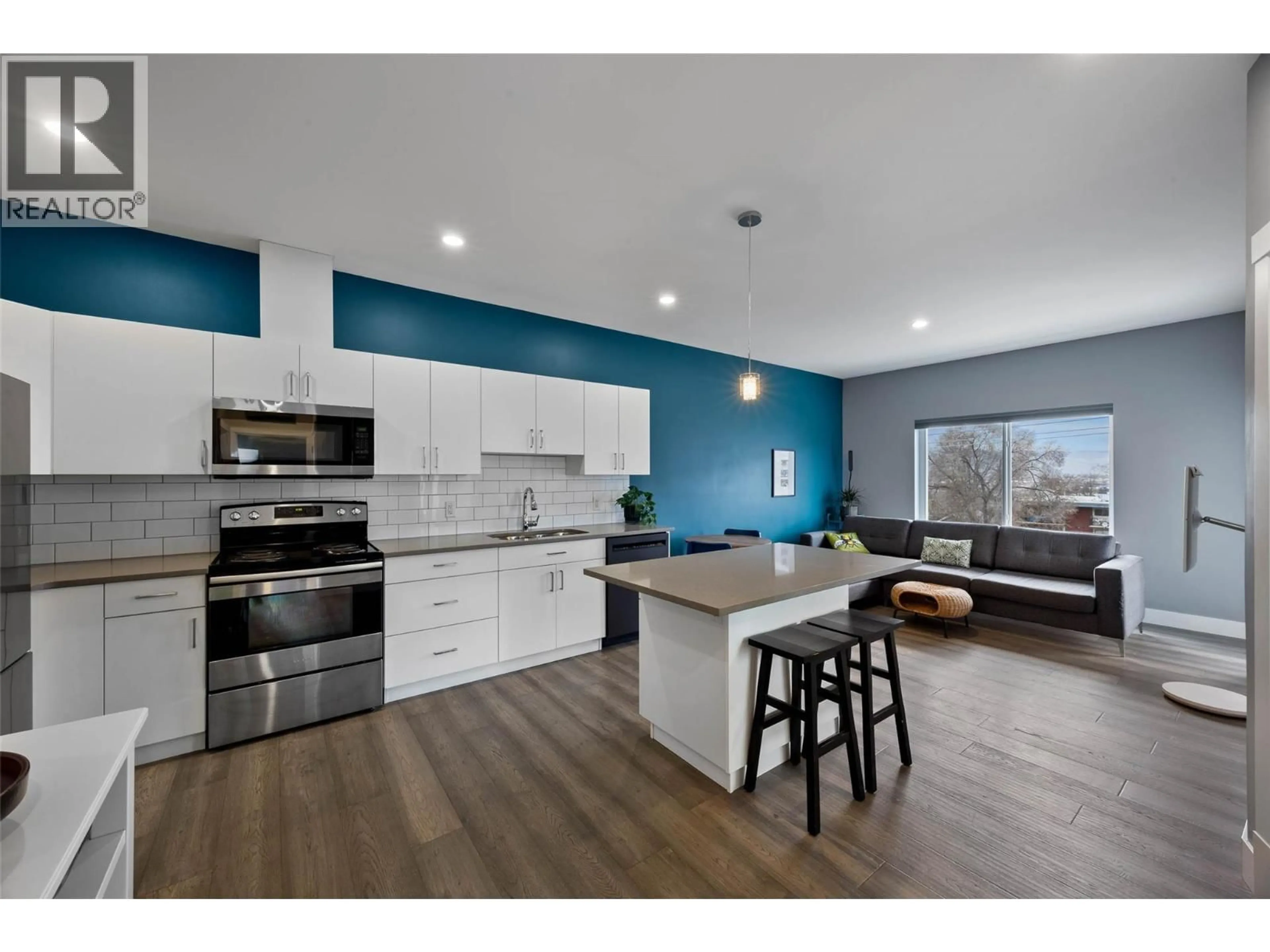 Open concept kitchen, wood/laminate floor for 404 - 777 BATTLE STREET, Kamloops British Columbia V2C2M6